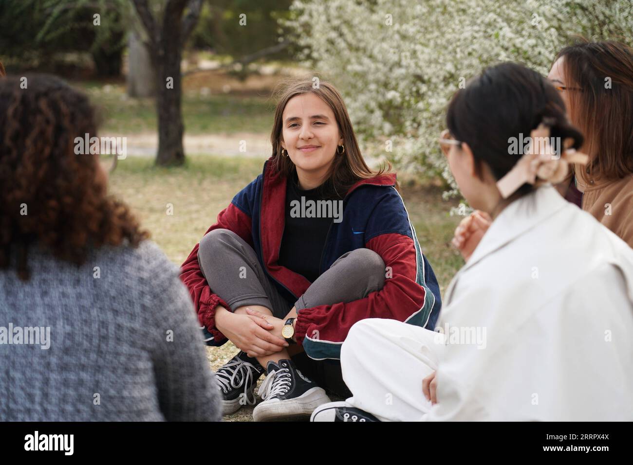 230415 -- BEIJING, April 15, 2023 -- Maria 2nd L chats with schoolmates at Peking University in Beijing, capital of China, March 31, 2023. Maria Eduarda Variani, Rafaela Viana dos Santos, Manuela Boiteux Pestana, and Marco Andre Rocha Germano are Brazilian students studying in the Master of China Studies program at the Yenching Academy of Peking University in China. The four of them have been interested in Chinese culture since they were young. After arriving in Beijing, they have been impressed by the Chinese capital s profound cultural heritage, convenient public services, and fabulous citys Stock Photo