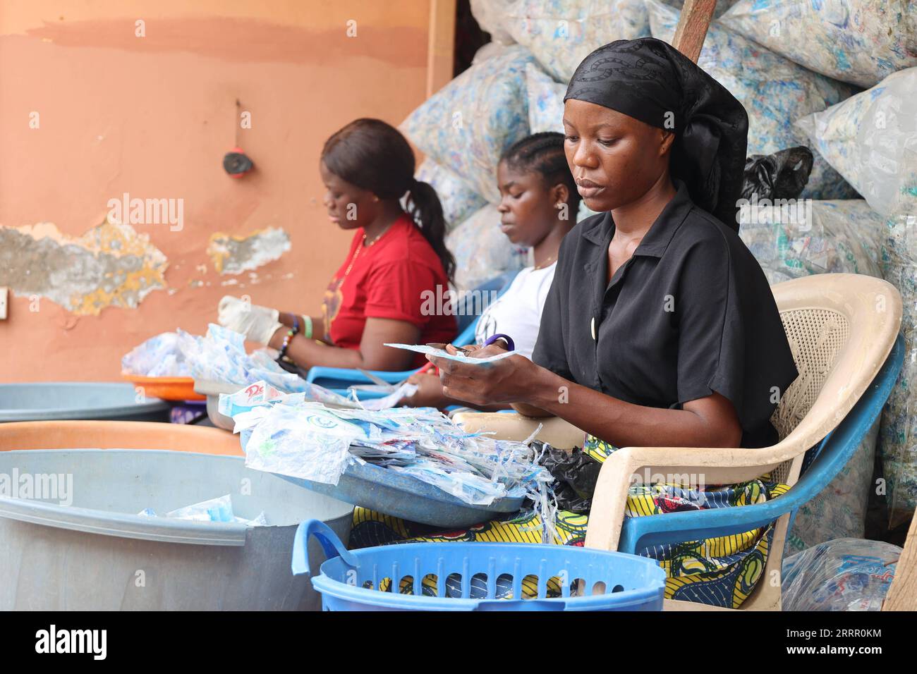 230421 ACCRA, April 21, 2023 Workers sort out plastic bags at a