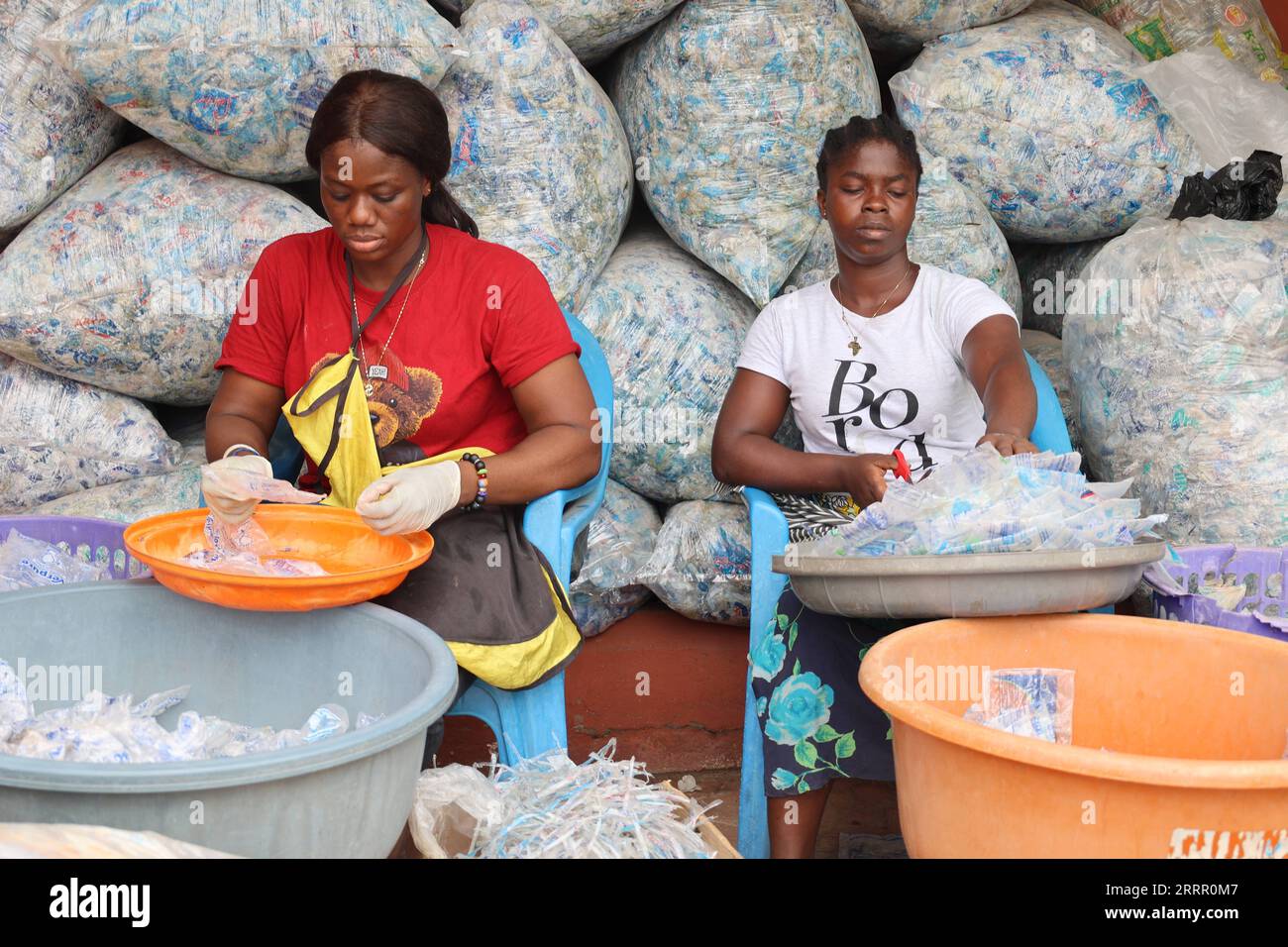 230421 ACCRA, April 21, 2023 Workers sort out plastic bags at a