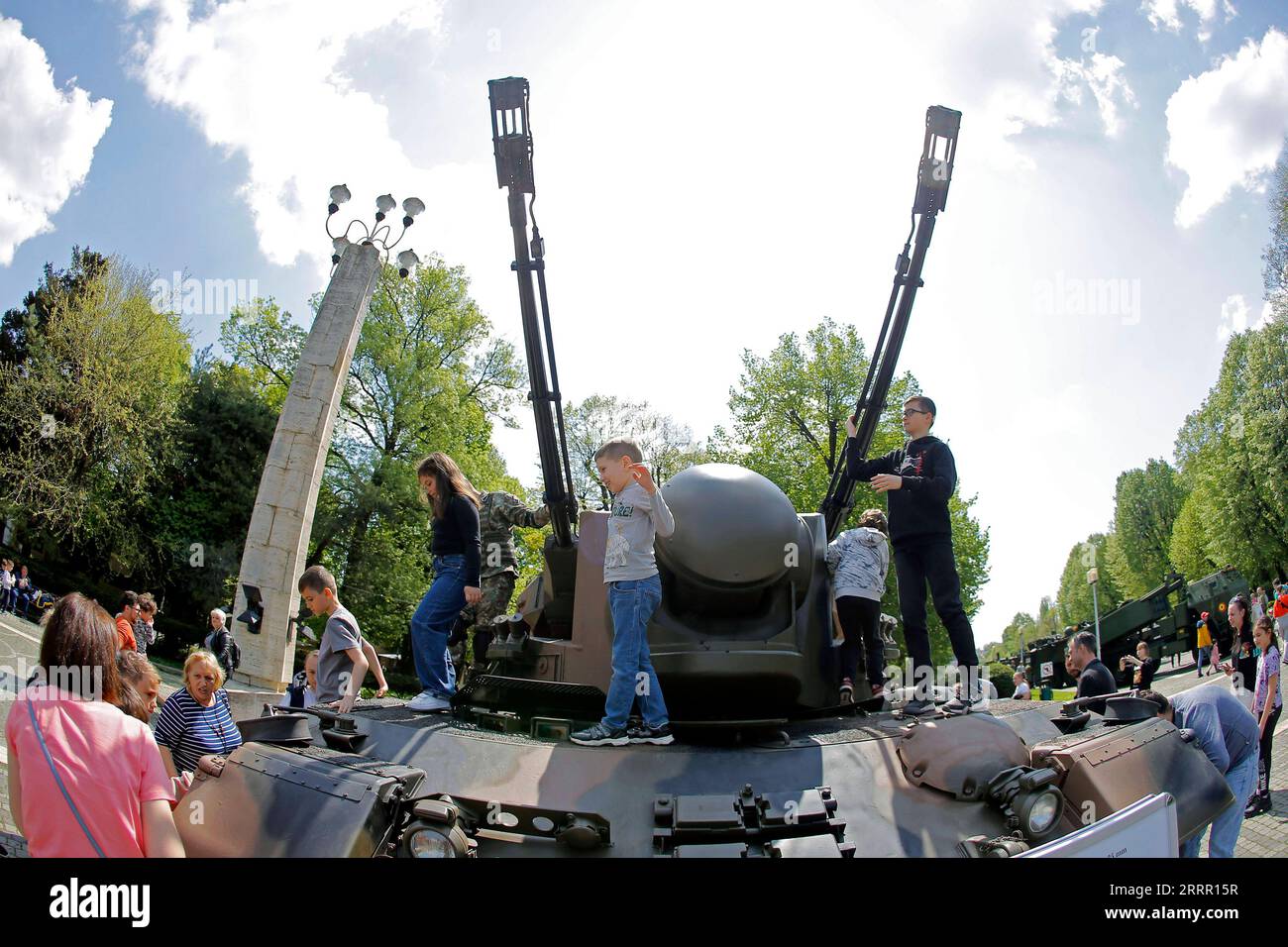 230424 -- BUCHAREST, April 24, 2023 -- Children have fun on an armoured vehicle at a static exhibition of military equipment marking Romanian Land Forces Day at a park in Bucharest, capital of Romania, April 23, 2023. Photo by /Xinhua ROMANIA-BUCHAREST-LAND FORCES DAY-EXHIBITION CristianxCristel PUBLICATIONxNOTxINxCHN Stock Photo