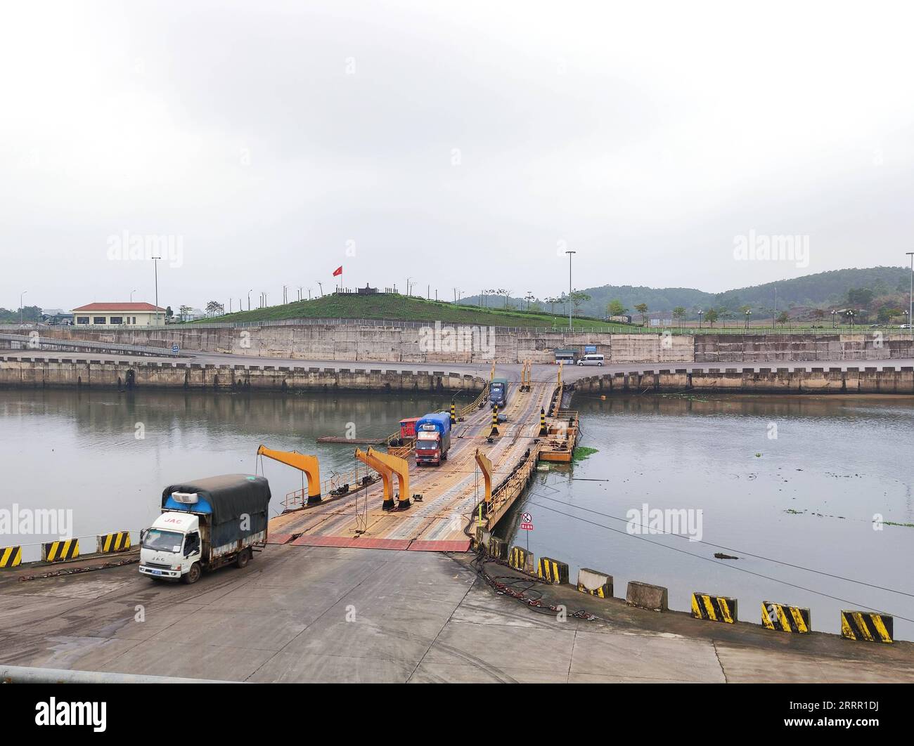 230425 -- NANNING, April 25, 2023 -- Cargo trucks cross a floating bridge which links south China s Guangxi Zhuang Autonomous Region and Vietnam over the Beilun River on April 12, 2023. TO GO WITH Economic Watch: RCEP boosts China-ASEAN economic, trade exchanges  CHINA-GUANGXI-NANNING-RCEP CN ZhuxLili PUBLICATIONxNOTxINxCHN Stock Photo