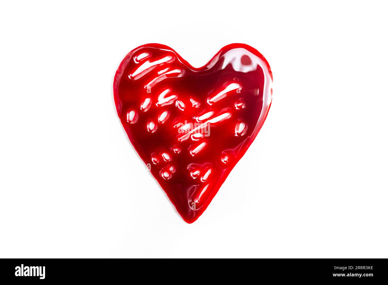 Heart shape made with red blood on white background Stock Photo