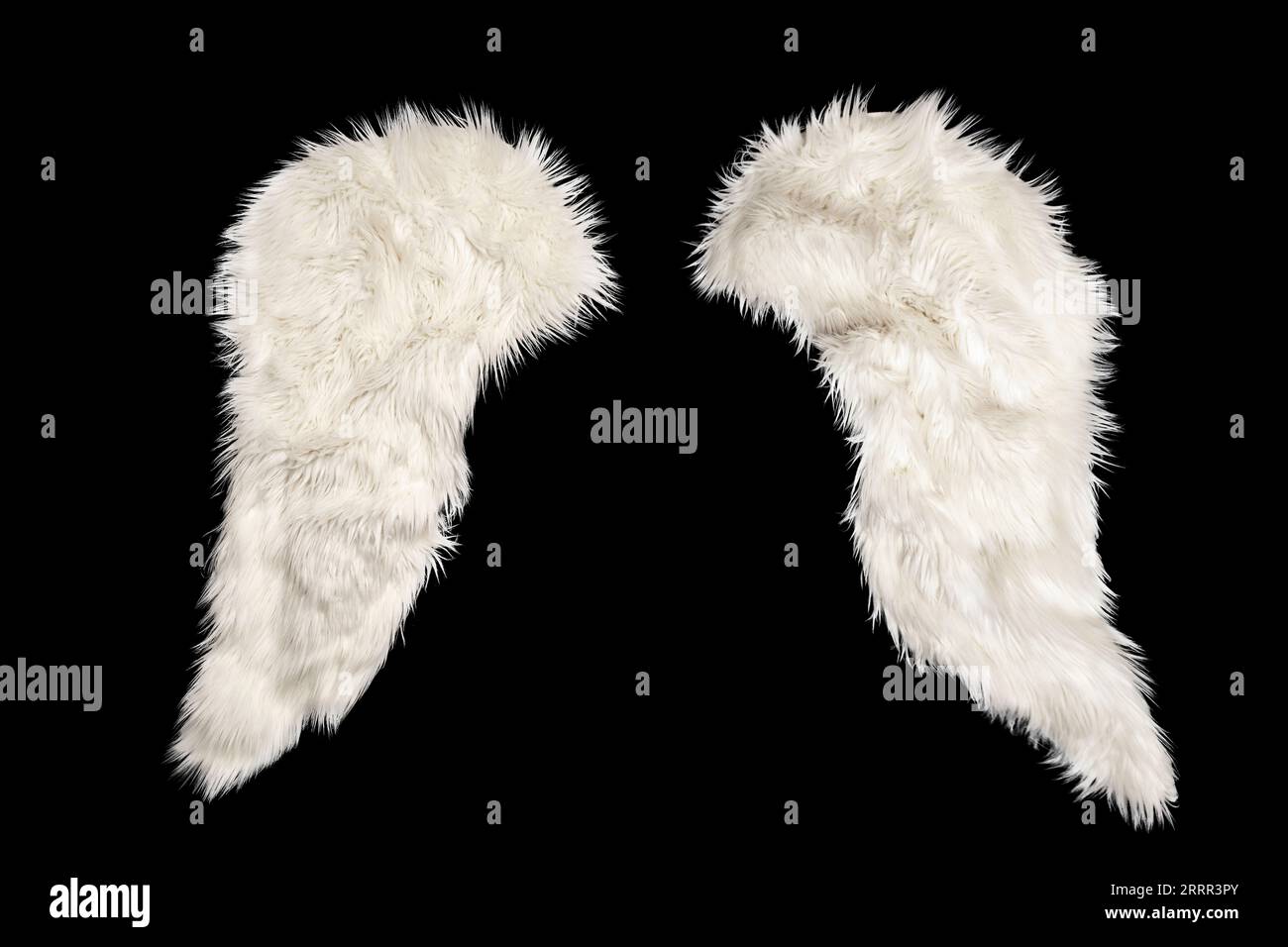two white furry wings isolated on  black background, festive mockup element Stock Photo