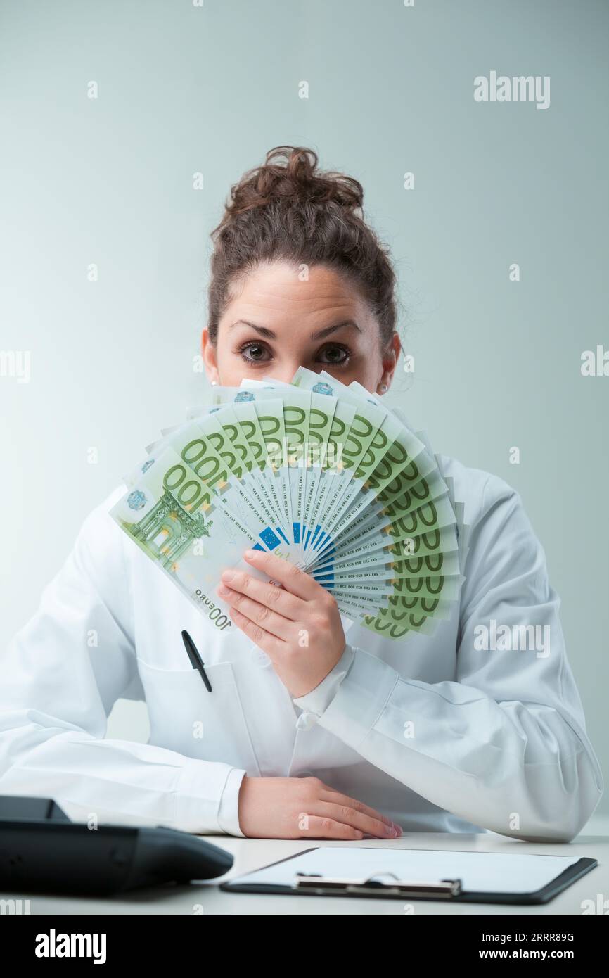 Satire shines as a defiant scientist woman showcases wealth. The imagery critiques intermediaries, hinting at potential dilution between true science Stock Photo