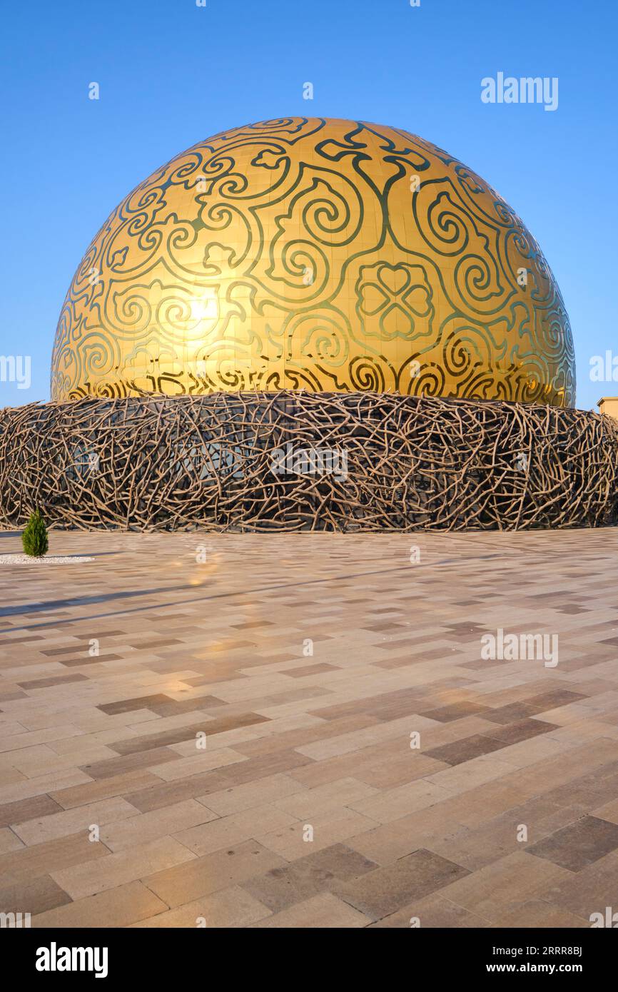 View of the gold dome, bird's nest design of the Samruk Flying Theater in the toursit zone. In Turkestan, Kazakhstan. Stock Photo