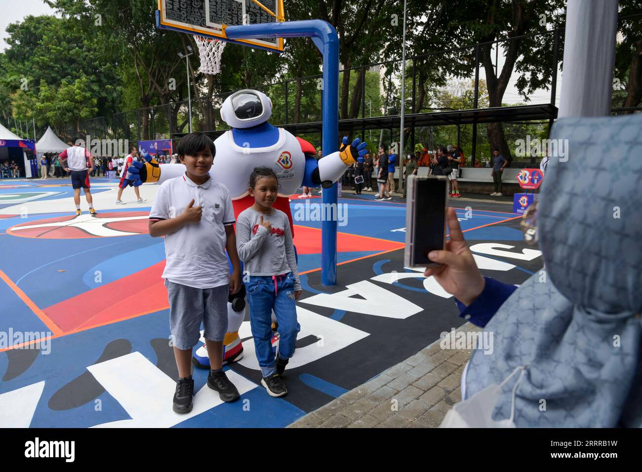 230520 -- JAKARTA, May 20, 2023 -- Kids pose with JIP, the official ...