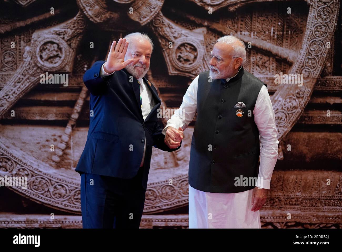 Brazil President Luiz Inacio Lula da Silva, left, waves as Indian Prime ...