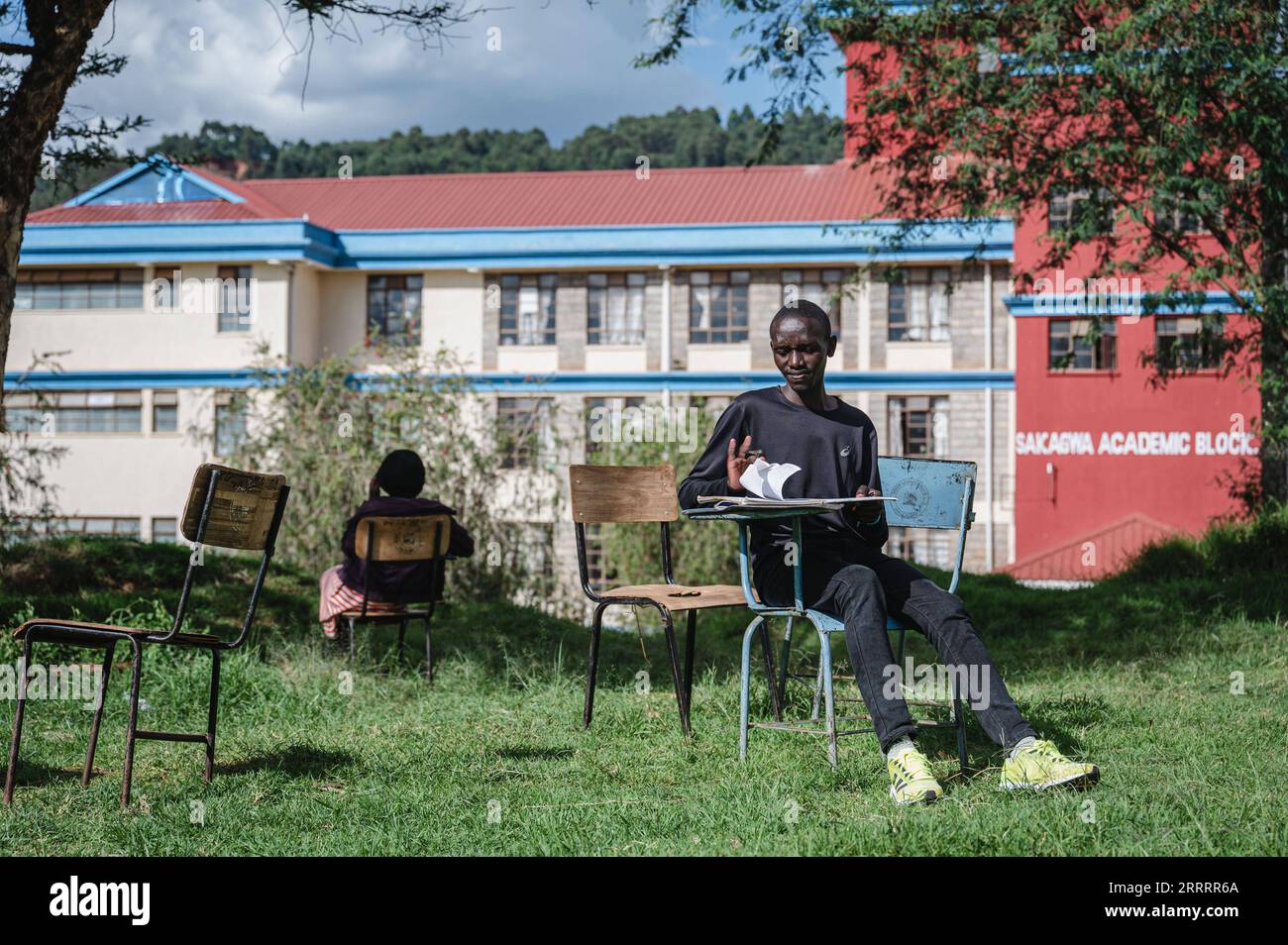 230611 -- ITEN, June 11, 2023 -- Kenyan runner Kelvin Kimtai Chepsigor R is seen at Kisii University in Kisii, Kenya, on June 6, 2023. At nearly 6 am, the first morning light shines upon the landmark arch written with Home of Champions in Iten, the runners gathered here to greet each other with a fist bump, stretch their muscles, and prepare for the first training session of the day. With an average altitude of 2,400 meters, Iten sits in the west of Kenya, near the Great Rift Valley of East Africa. It is an ideal long-distance running training place and is the cradle of many world-class middle Stock Photo