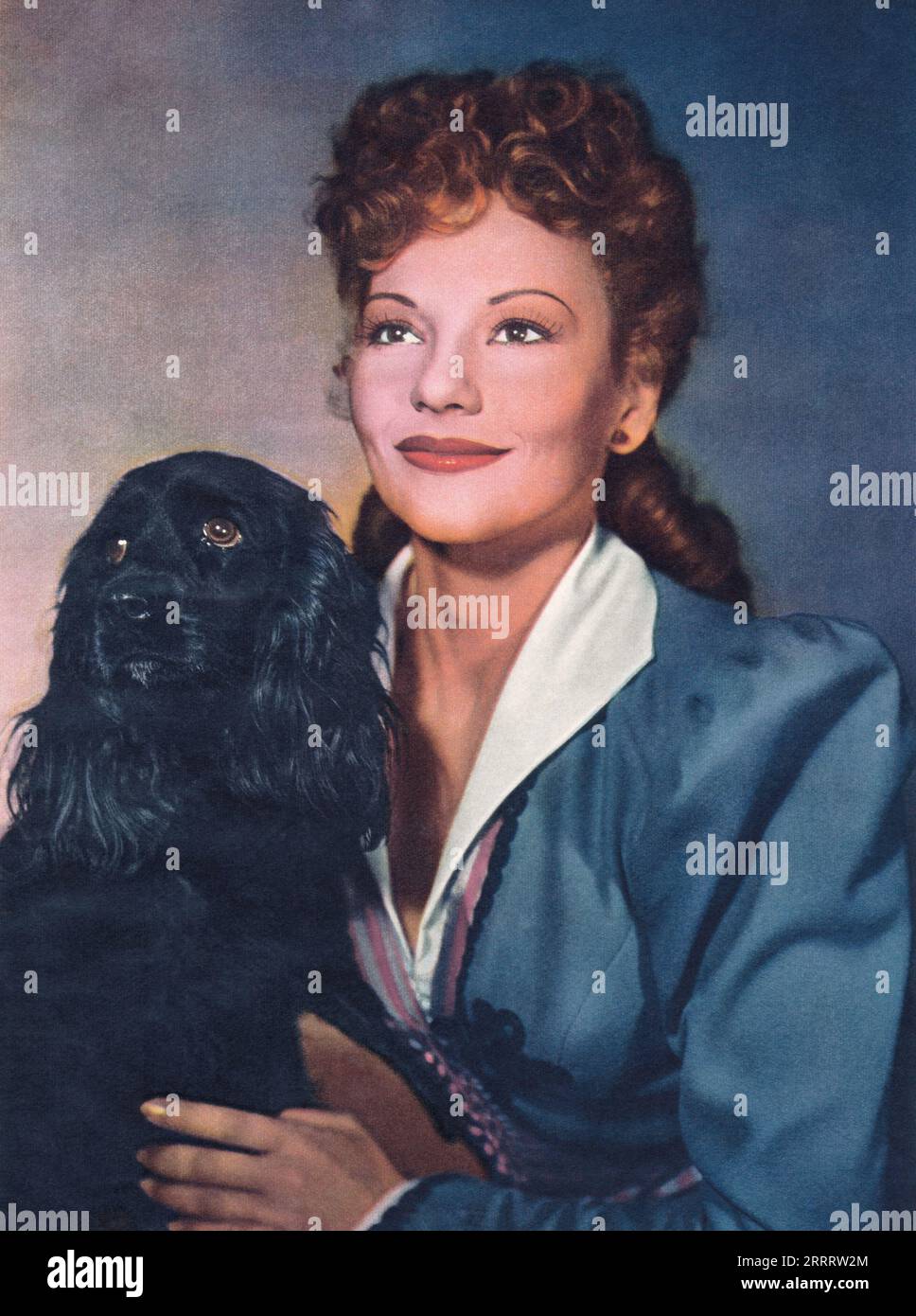 1946 publicity photo of actress Jorja Curtright with a dog. Stock Photo