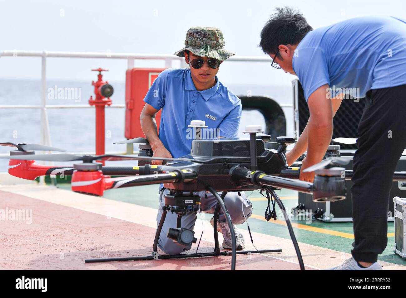 230617 -- HAIKOU, June 17, 2023 -- Staff members test an unmanned aerial vehicle for conducting an open-sea testing of the low-Earth orbit broadband communication test constellation at the Dian Ke No.1 comprehensive test ship, June 15, 2023. Researchers from the GalaxySpace, a Beijing-based satellite maker, and several scientific research institutions, conducted an open-sea testing of the country s first low-Earth orbit broadband communication test constellation in the South China Sea. The testing aims to verify the collaborative communication coverage ability of high-Earth orbit and low-Earth Stock Photo