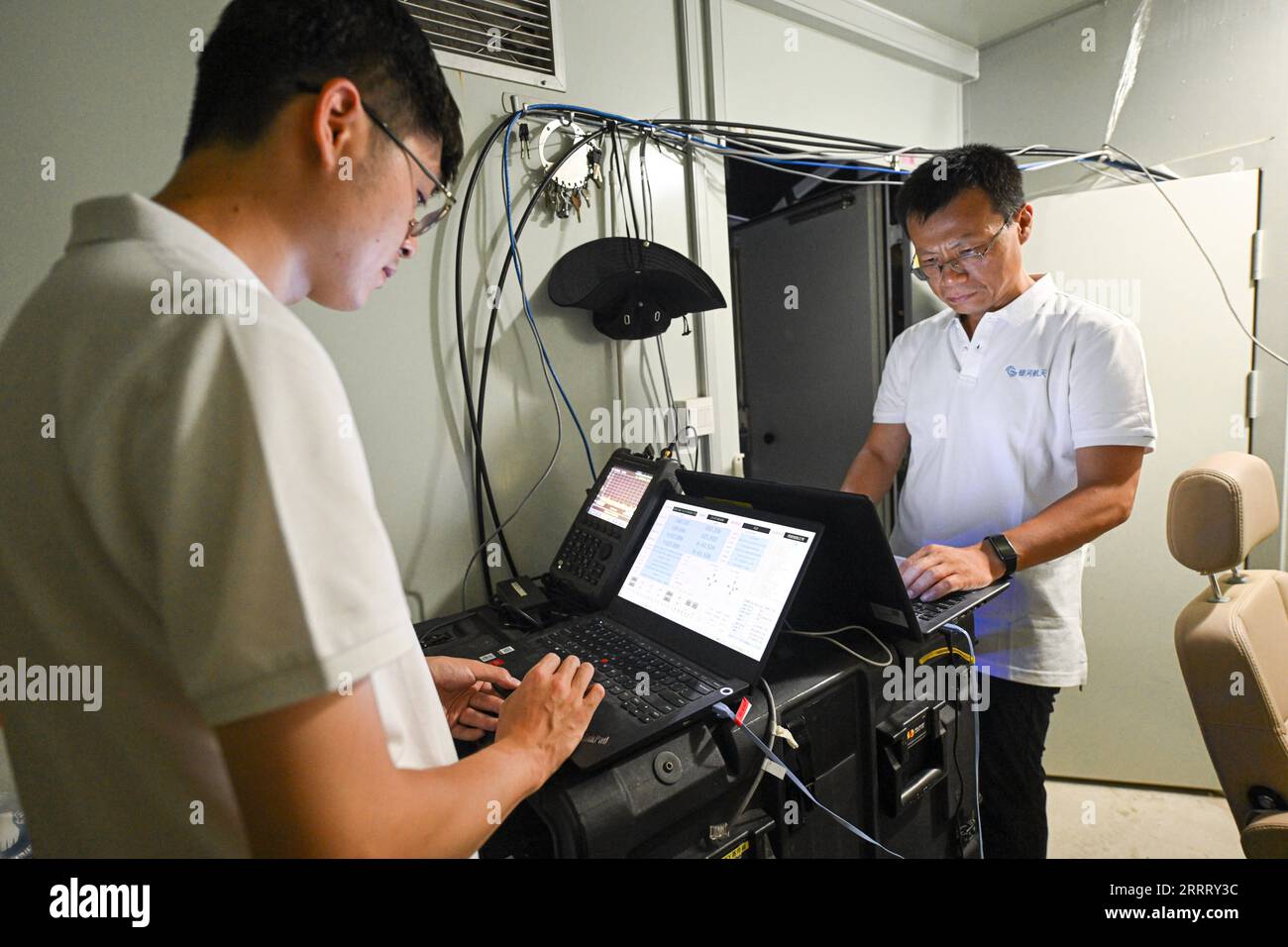 230617 -- HAIKOU, June 17, 2023 -- Staff members test devices at a low-Earth orbit gateway station in Lingshui Li Autonomous County, south China s Hainan Province, June 13, 2023. Researchers from the GalaxySpace, a Beijing-based satellite maker, and several scientific research institutions, conducted an open-sea testing of the country s first low-Earth orbit broadband communication test constellation in the South China Sea. The testing aims to verify the collaborative communication coverage ability of high-Earth orbit and low-Earth orbit satellites, and unmanned aerial vehicles. In March 2022, Stock Photo