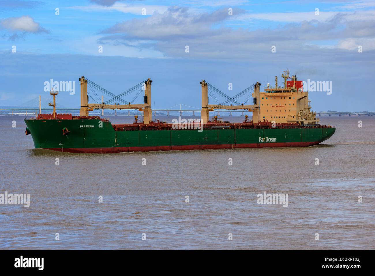 Bulk carrier heading out to sea Stock Photo