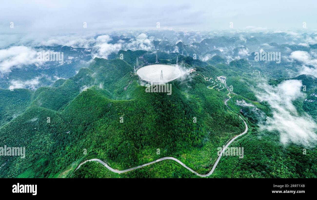 230623 -- PINGTANG, June 23, 2023 -- This aerial photo taken on June 22, 2023 shows China s Five-hundred-meter Aperture Spherical Radio Telescope FAST under maintenance in southwest China s Guizhou Province. China s FAST telescope identified a binary pulsar with an orbital period of 53.3 minutes, the shortest known period for a pulsar binary system. The research, mainly conducted by a team led by scientists from the National Astronomical Observatories of the Chinese Academy of Sciences NAOC, was published in the journal Nature Wednesday.  EyesonSciCHINA-GUIZHOU-FAST-TELESCOPE-BINARY PULSAR-DET Stock Photo
