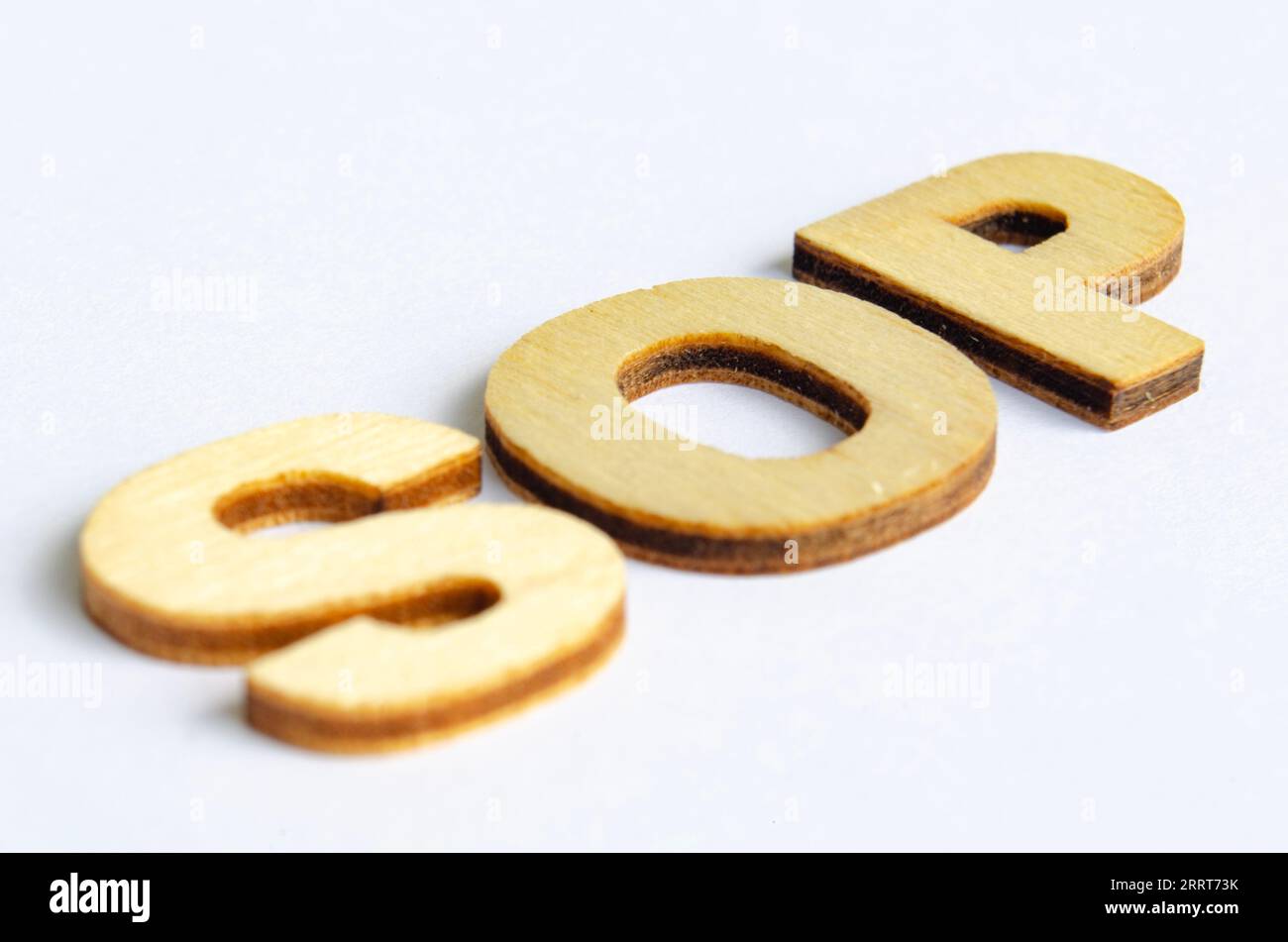 SOP wooden text on white notepad. Standard operating procedure concept. Stock Photo