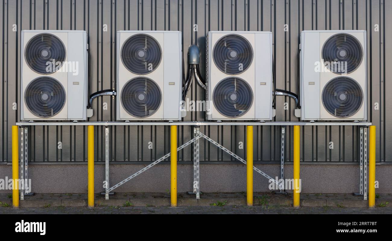 Multiple Air Conditioner Units on Building Exterior for Efficient Cooling Stock Photo