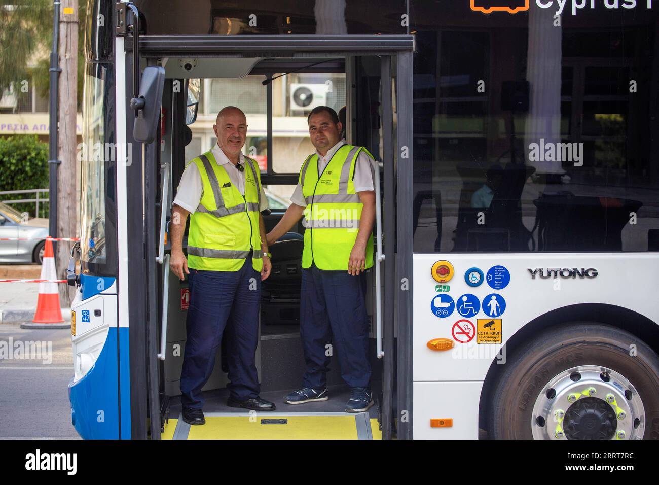 230704 -- NICOSIA, July 4, 2023 -- Drivers stand on a Chinese-made electric bus in Nicosia, Cyprus, on July 4, 2023. Cyprus Public Transport CPT rolled out on Tuesday a fleet of five new Chinese-made electric buses to offer cleaner, greener transit options on the Mediterranean island. Photo by /Xinhua TO GO WITH Feature: China helps Cyprus public transport go electric CYPRUS-NICOSIA-CHINA-ELECTRIC BUSES GeorgexChristophorou PUBLICATIONxNOTxINxCHN Stock Photo