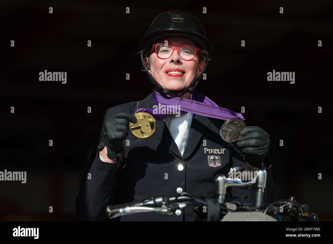 Riesenbeck, Germany. 09th Sep, 2023. Equestrian sport: European Championship, Para-Dressage, Freestyle Grade II. German para-dressage rider Heidemarie Dresing poses with her medals. Credit: Friso Gentsch/dpa/Alamy Live News Stock Photo