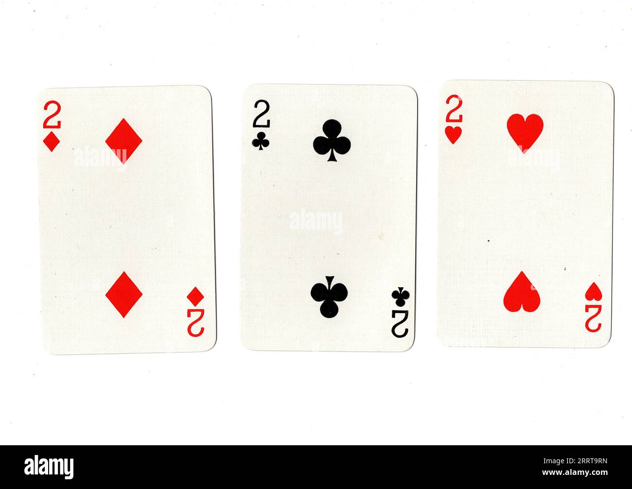 Vintage playing cards showing three twos on a white background Stock ...