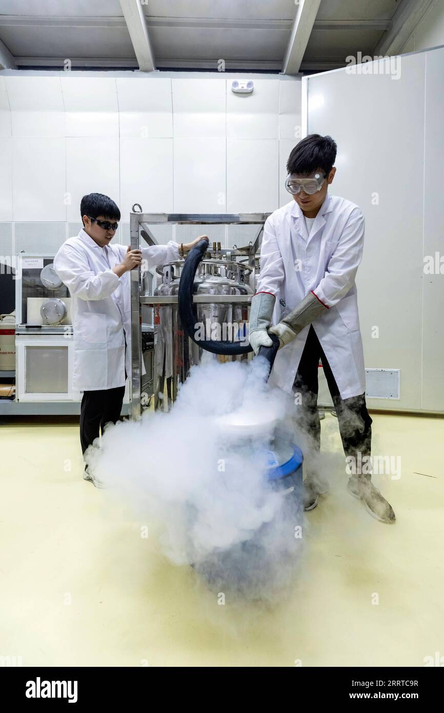 230715 -- XICHANG, July 15, 2023 -- Researchers pour liquid nitrogen into a pot for experiment at the China Jinping Underground Laboratory in southwest China s Sichuan Province, July 3, 2023. Jinping Mountain, located in the drainage basin of the Yalong River, the largest tributary of Jinsha River, has the highest altitude of 4,410 meters. The China Jinping Underground Laboratory CJPL is located in the middle of the 17.5 kilometer-long Jinping tunnel in southwest China s Sichuan Province. The laboratory, inaugurated in 2010, is an underground research facility with a rock overburden of about 2 Stock Photo