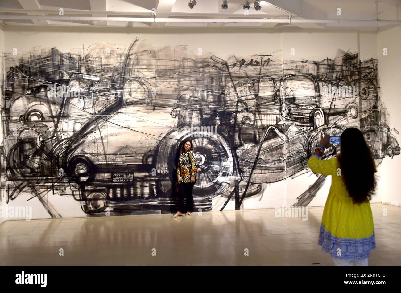 230717 DHAKA, July 17, 2023 A woman poses for photos in front of