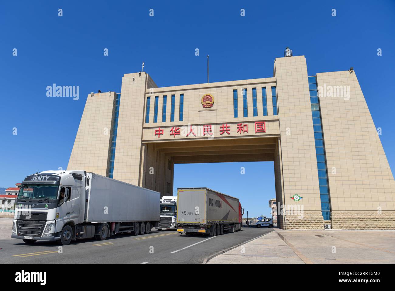 230725 -- ALATAW PASS, July 25, 2023 -- Cargo trucks are pictured at the Alataw Pass in northwest China s Xinjiang Uygur Autonomous Region, July 24, 2023. In recent years, various measures have been taken to create a better business environment for cross-border e-commerce enterprises in Alataw Pass. The cross-border e-commerce business was launched in the inland port in northwest China s Xinjiang Uygur Autonomous Region in January 2020. In the first half of this year, more than 14.50 million cross-border e-commerce packages worth about 1.677 billion yuan about 235 million U.S. dollars have bee Stock Photo