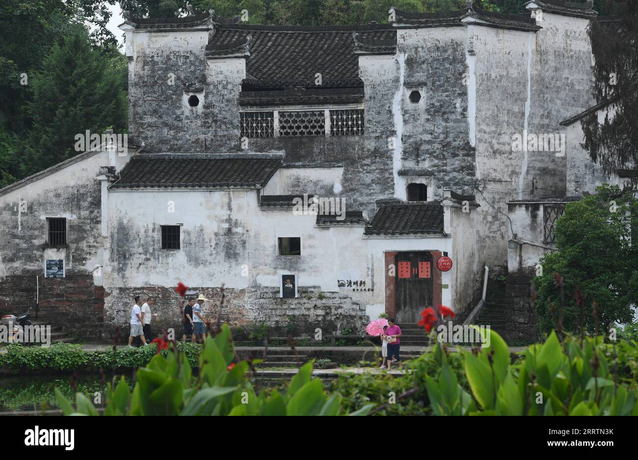 230802 -- JINHUA, Aug. 2, 2023 -- Tourists visit the Zhuge Village of Lanxi City, east China s Zhejiang Province, Aug. 1, 2023. The Zhuge Village, a historic gem with over 300 ancient buildings dating back to Ming and Qing dynasties 1368-1911, is home to descendents of Zhuge Liang, a renowned military strategist in the Three Kingdom Period 220-280. The village has made concerted efforts to preserve the ancient heritages and develop tourism, receiving over 500,000 visitors annually.  ZhejiangPictorial CHINA-ZHEJIANG-VILLAGE-ANCIENT BUILDING CN WengxXinyang PUBLICATIONxNOTxINxCHN Stock Photo