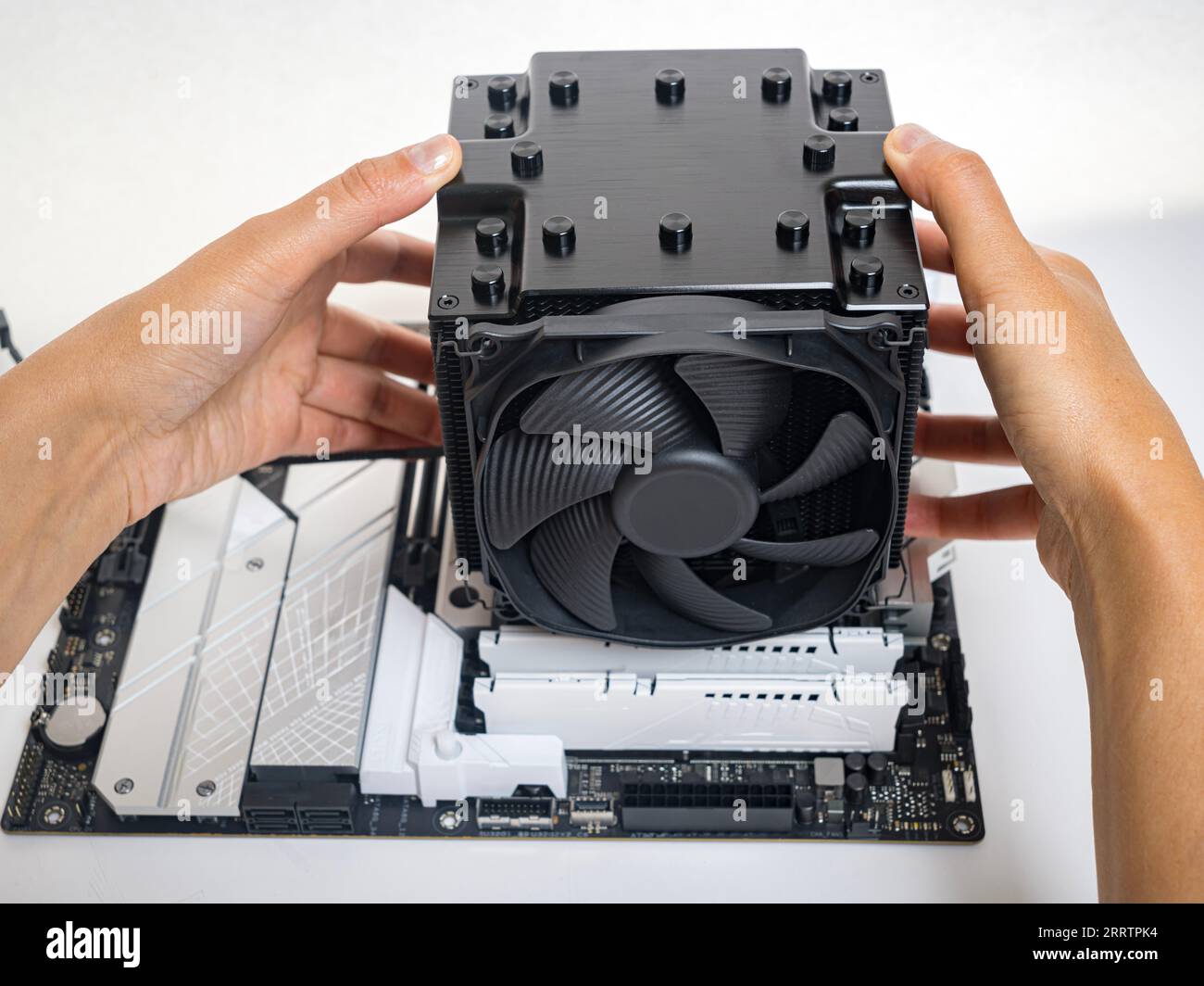 Installing a large cooler on a computer processor Stock Photo - Alamy