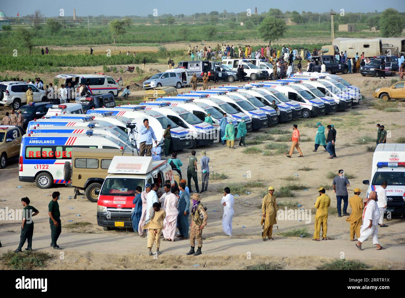 230807 -- SANGHAR, Aug. 7, 2023 -- Ambulances park at the site of a train accident in Sanghar district of Pakistan s southern Sindh province, on Aug. 6, 2023. At least 22 people were killed and over 50 others injured on Sunday after a passenger train derailed in the Sanghar district of Pakistan s southern Sindh province, local police said. The accident took place when 10 coaches of the Hazara Express train derailed when it was crossing a canal bridge near Sarhari town in the Shahdadpur area of the district, Muhammad Younis Chandio, deputy inspector general of police of the region, told the med Stock Photo