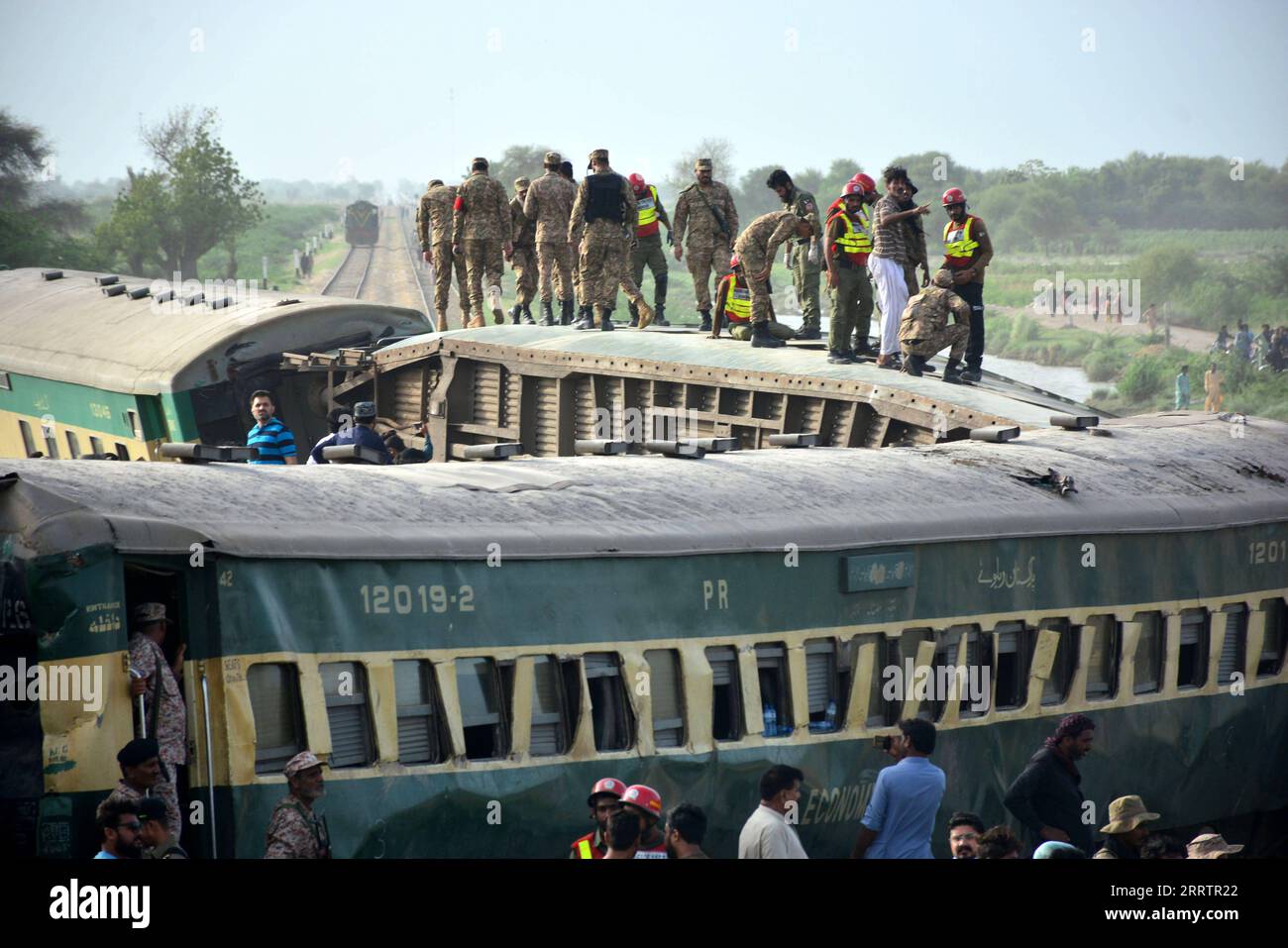 230807 -- SANGHAR, Aug. 7, 2023 -- Paramilitary personnel search for victims on derailed coaches of a passenger train in Sanghar district of Pakistan s southern Sindh province, on Aug. 6, 2023. At least 22 people were killed and over 50 others injured on Sunday after a passenger train derailed in the Sanghar district of Pakistan s southern Sindh province, local police said. The accident took place when 10 coaches of the Hazara Express train derailed when it was crossing a canal bridge near Sarhari town in the Shahdadpur area of the district, Muhammad Younis Chandio, deputy inspector general of Stock Photo