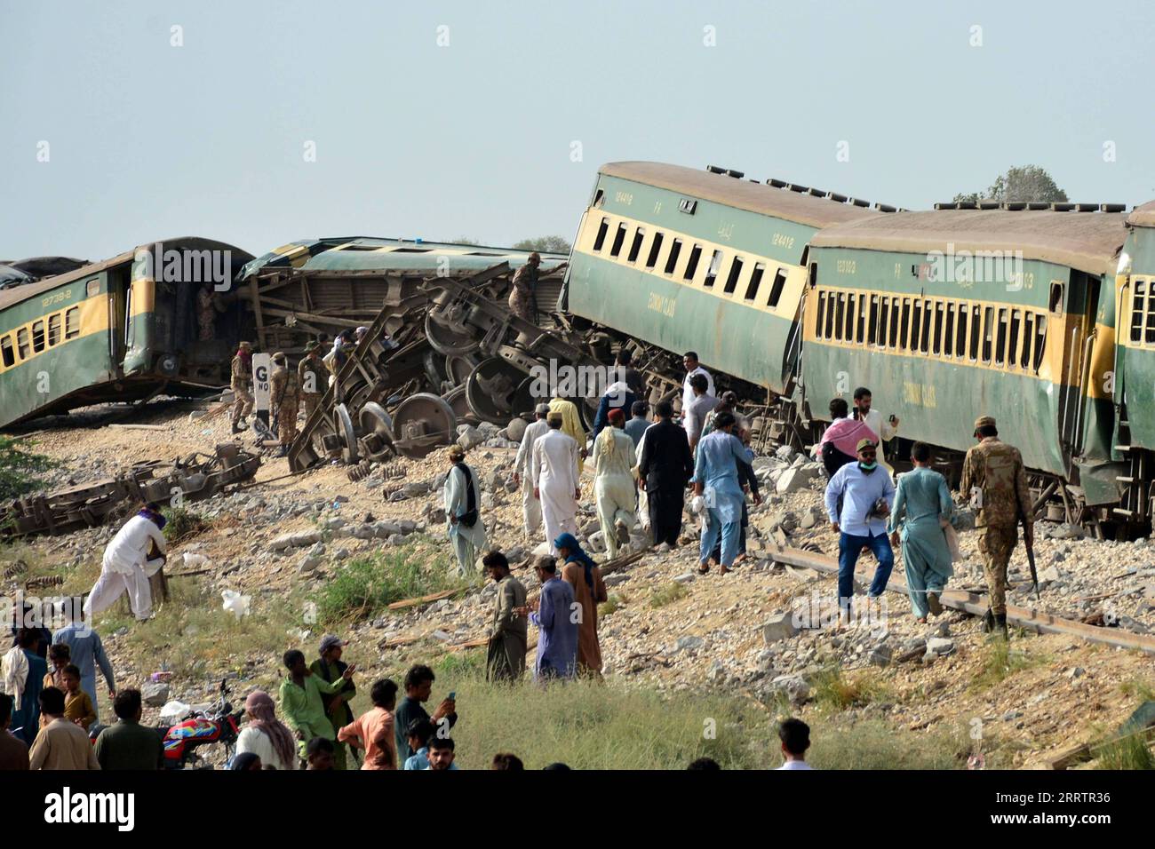 News Bilder des Tages 230807 -- SANGHAR, Aug. 7, 2023 -- People gather near derailed coaches of a passenger train in Sanghar district of Pakistan s southern Sindh province, on Aug. 6, 2023. At least 22 people were killed and over 50 others injured on Sunday after a passenger train derailed in the Sanghar district of Pakistan s southern Sindh province, local police said. The accident took place when 10 coaches of the Hazara Express train derailed when it was crossing a canal bridge near Sarhari town in the Shahdadpur area of the district, Muhammad Younis Chandio, deputy inspector general of pol Stock Photo