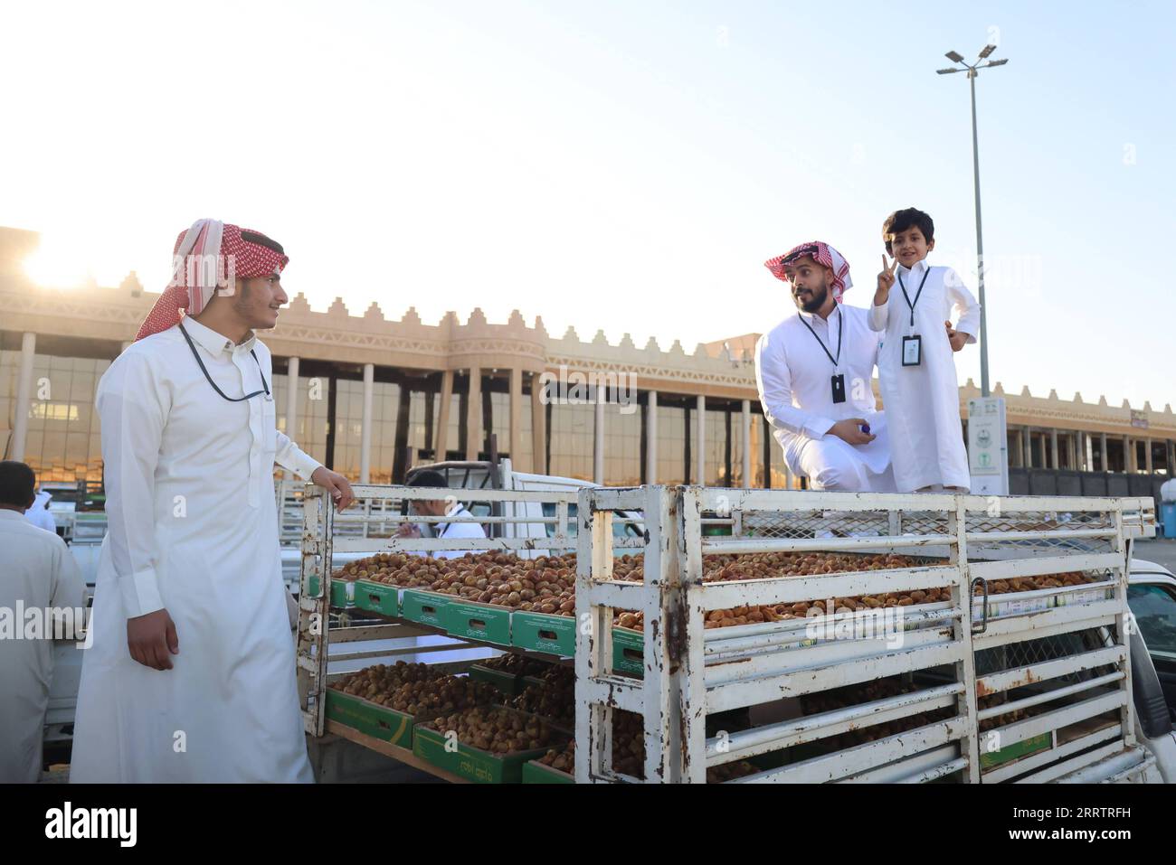 230807 -- QASSIM SAUDI ARABIA, Aug. 7, 2023 -- People sell boxes of