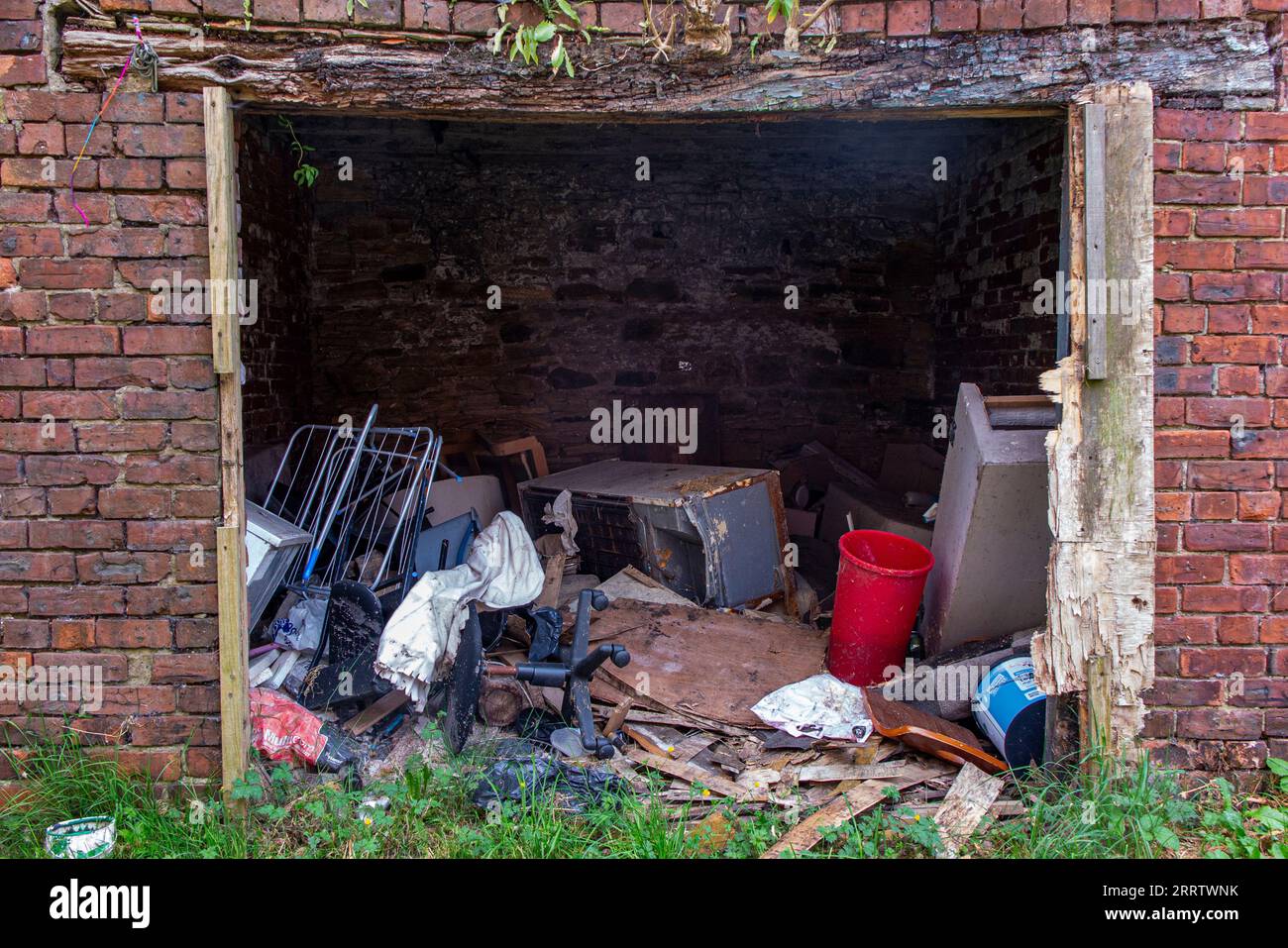 Lots of rubbish thrown into an old building Stock Photo