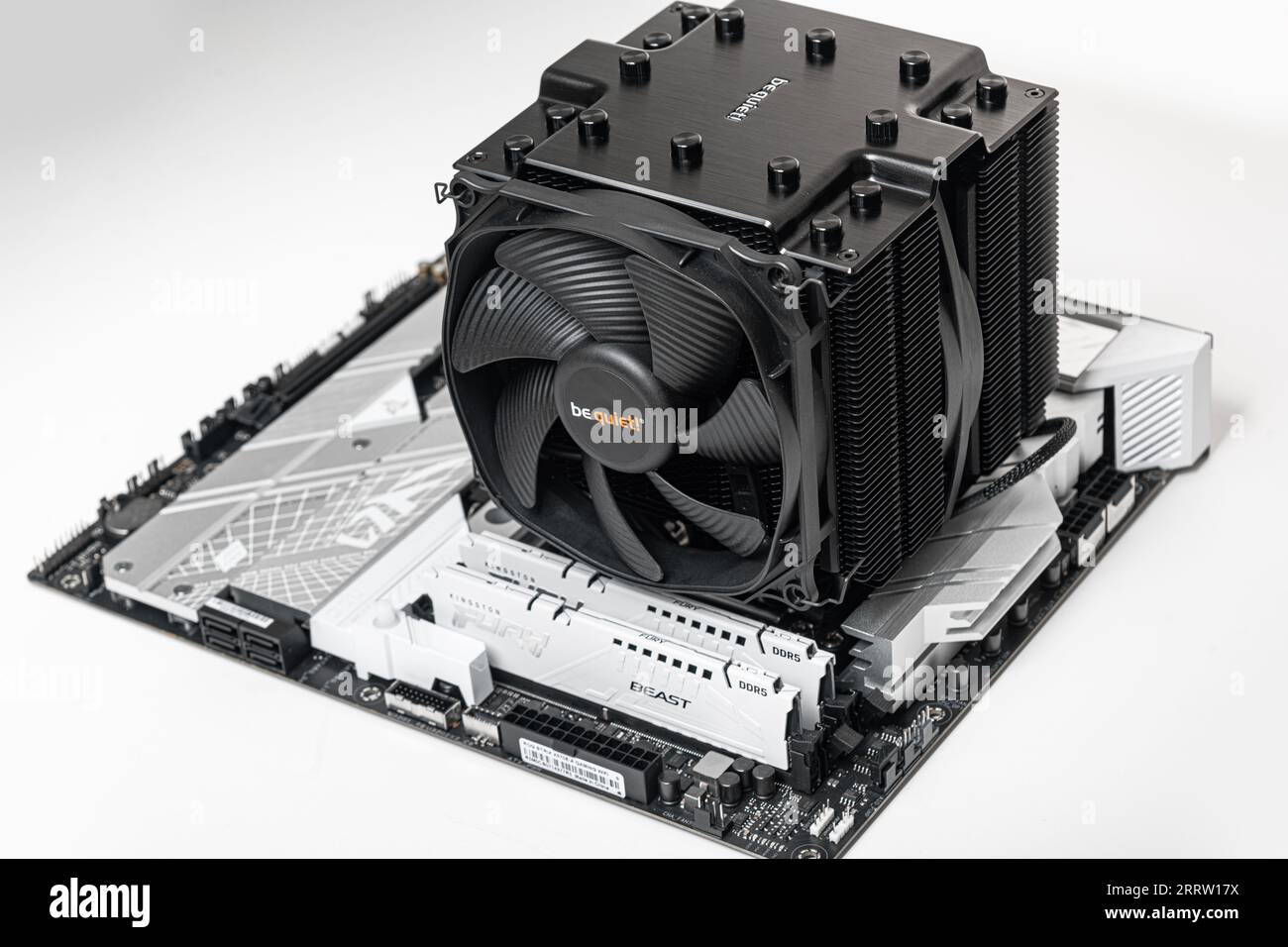 Installing a be quiet CPU cooler Dark Rock Pro 4 on the motherboard. Stock Photo