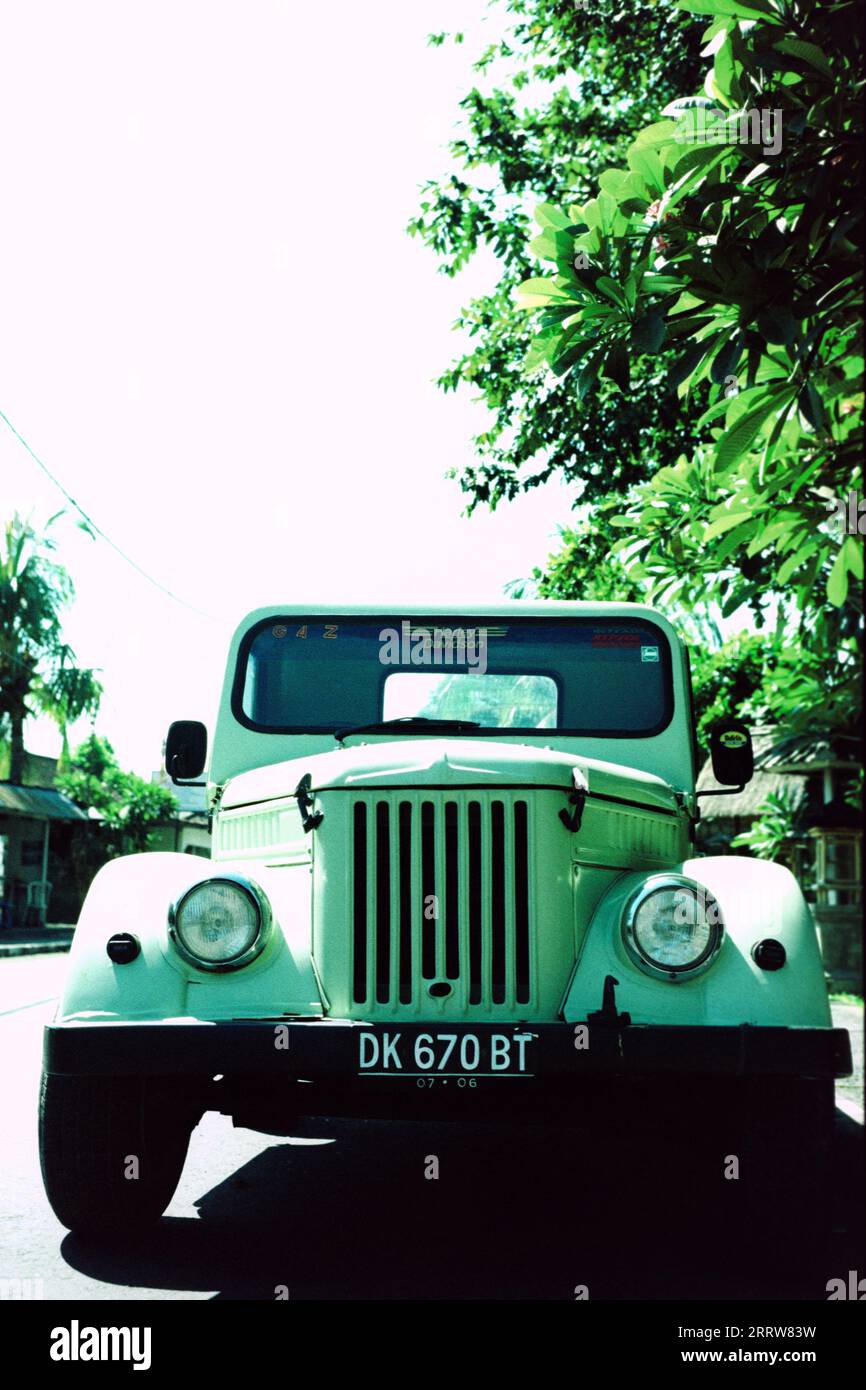 Old American made truck parked on the side of the road in Bali Stock Photo