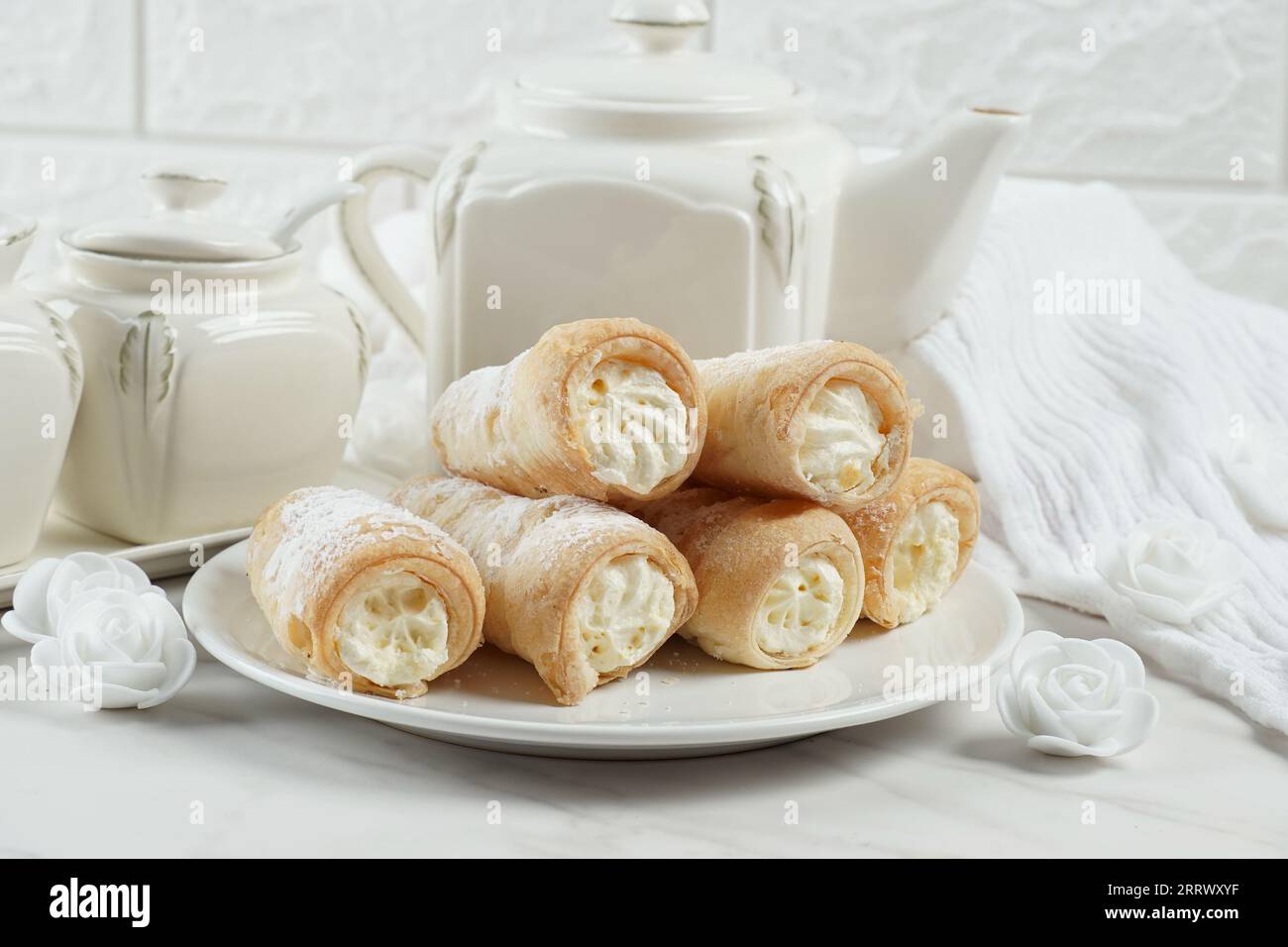 Puff rolls with vanilla cream. Delicious cream horns filled with