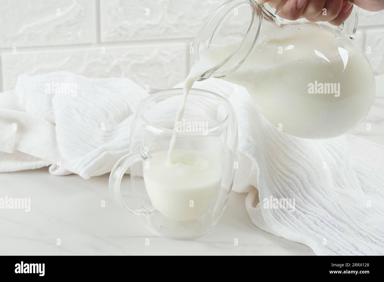 close up of woman hand pouring milk to blender Stock Photo - Alamy