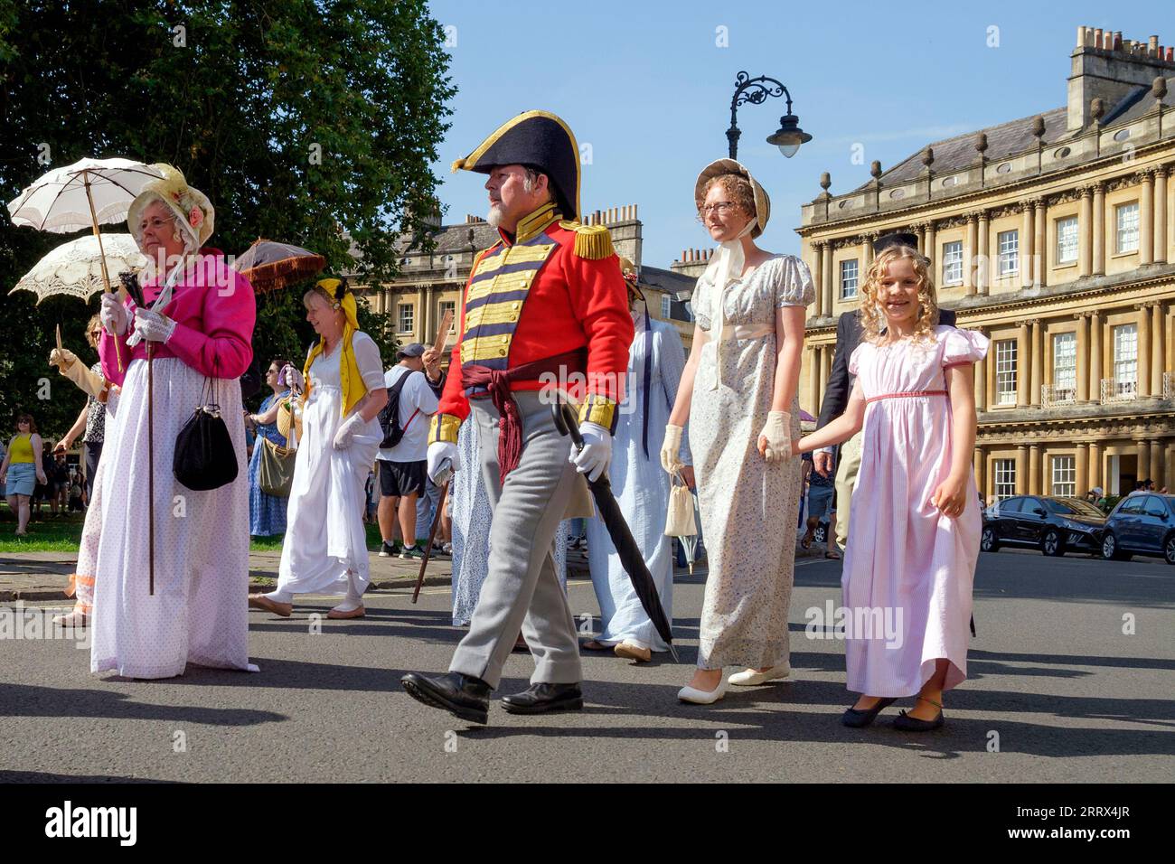 Bath, UK. 9th Sep, 2023. Jane Austen fans taking part in the world-famous Grand Regency Costumed Promenade are pictured as they walk around the Circus. The Promenade, part of the Jane Austen Festival is a procession through the streets of Bath and the participants who come from all over the world and dress in 18th Century costume. Credit: Lynchpics/Alamy Live News Stock Photo