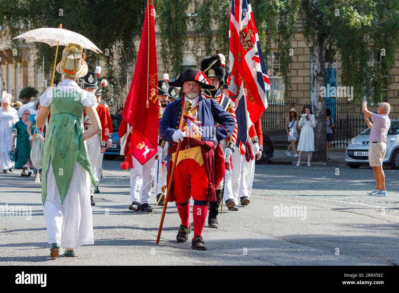 Bath, UK. 9th Sep, 2023. Members of the re-enactment group, His Majesty's 33rd Regiment of Foot are pictured marching down Great Pulteney Street as they take part in the world famous Grand Regency Costumed Promenade. The Promenade, part of the 10 day Jane Austen Festival is a procession through the streets of Bath and the participants who come from all over the world dress in 18th Century costume. Credit: Lynchpics/Alamy Live News Stock Photo