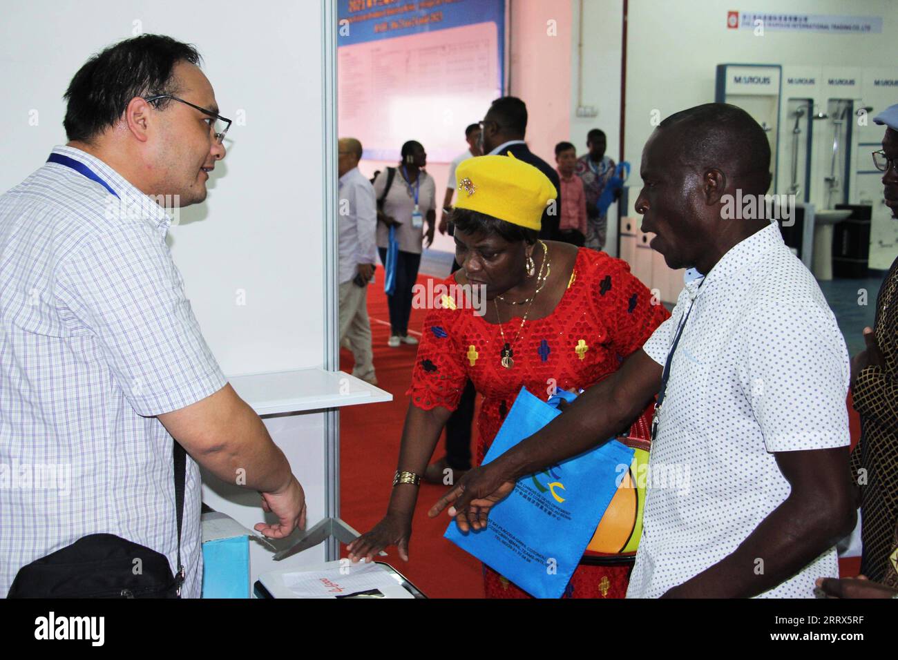 230822 -- COTONOU, Aug. 22, 2023 -- People visit the 13th edition of the Chinese Products Fair in Cotonou, Benin, Aug. 21, 2023. The 13th edition of the Chinese Products Fair opened in Cotonou, Benin s economic capital, Monday. About 100 stands representing more than 40 Chinese exhibitors are showcasing their products in exhibition space covering 2,500 square meters. The products on display include home appliances, electronics and digital items, machinery and accessories, hardware products, building materials and office supplies. Photo by /Xinhua BENIN-COTONOU-CHINESE PRODUCTS FAIR SeraphinxZo Stock Photo