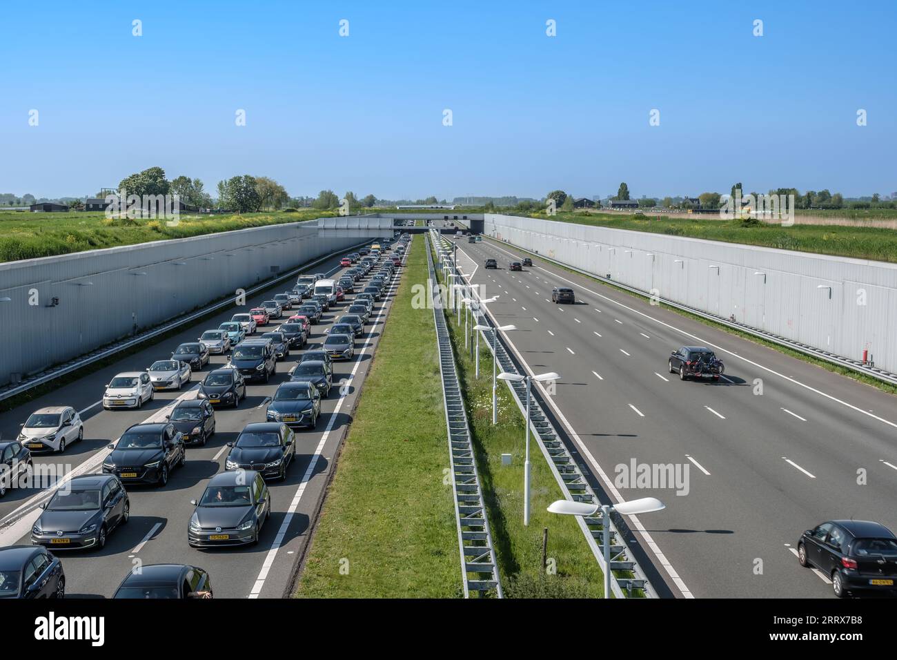 Modern deepened motorway A4 close to Rotterdam, Netherlands., Traffic jam direction Rotterdam Netherlands Stock Photo