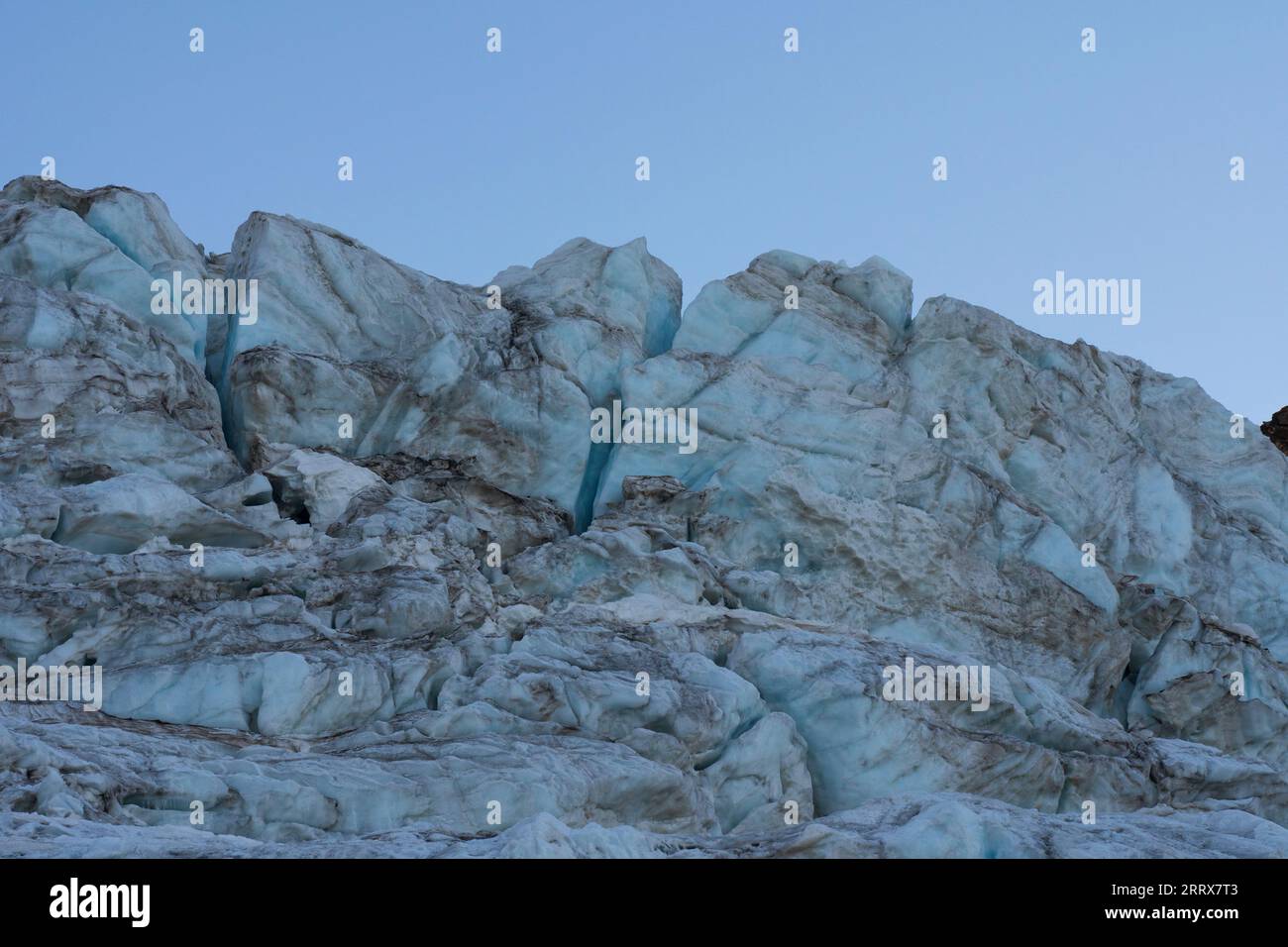 Glacier in the alpine mountains, crevasses and ice details. Gran ...
