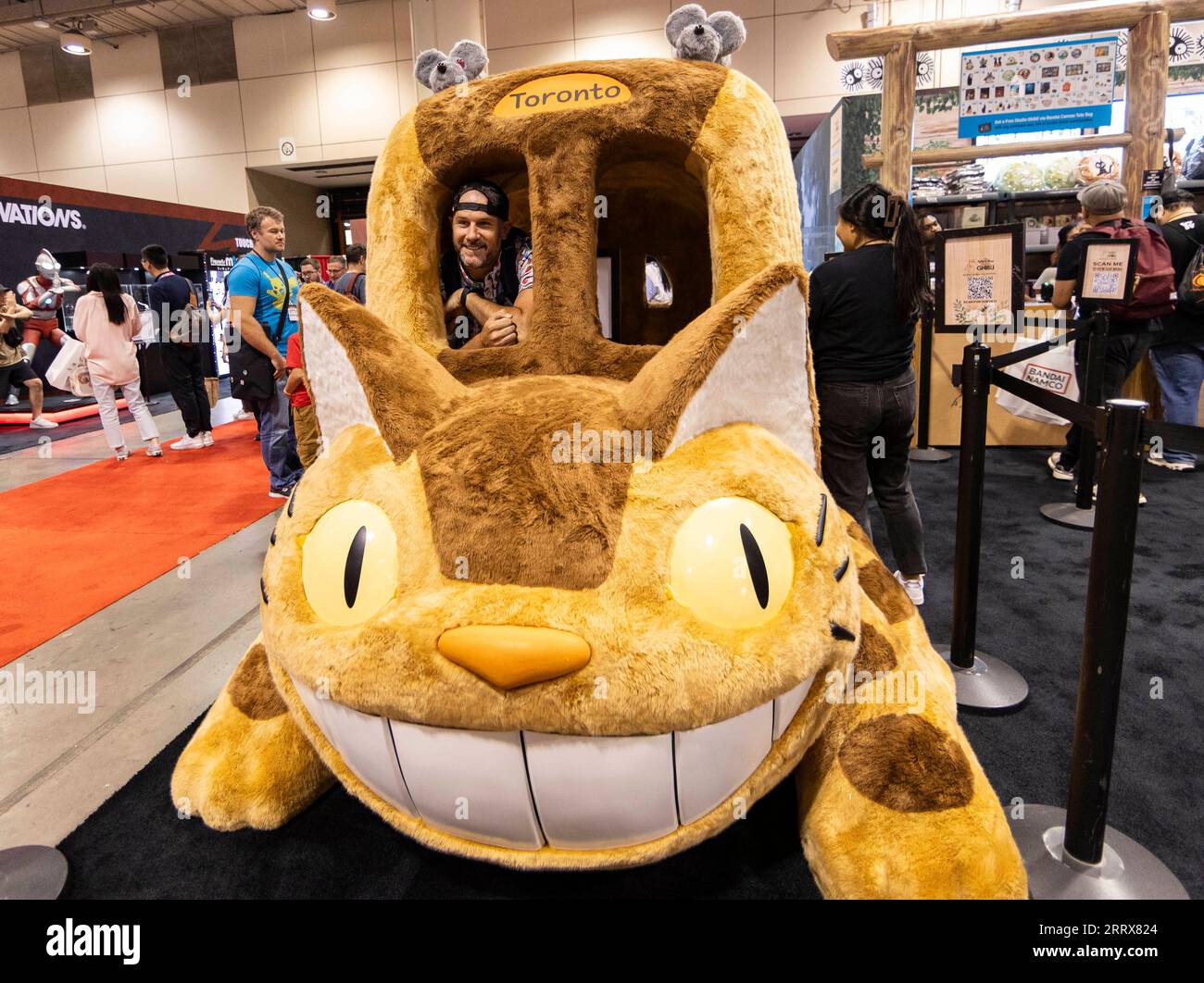 230825 -- TORONTO, Aug. 25, 2023 -- A man poses for photos on the Catbus during the 2023 Fan Expo Canada in Toronto, Canada, on Aug. 25, 2023. As one of the largest comics, sci-fi, anime and gaming events in Canada, the annual event is held here from Aug. 24 to Aug. 27, attracting hundreds of thousands of fans from across the world. Photo by /Xinhua CANADA-TORONTO-FAN EXPO CANADA ZouxZheng PUBLICATIONxNOTxINxCHN Stock Photo
