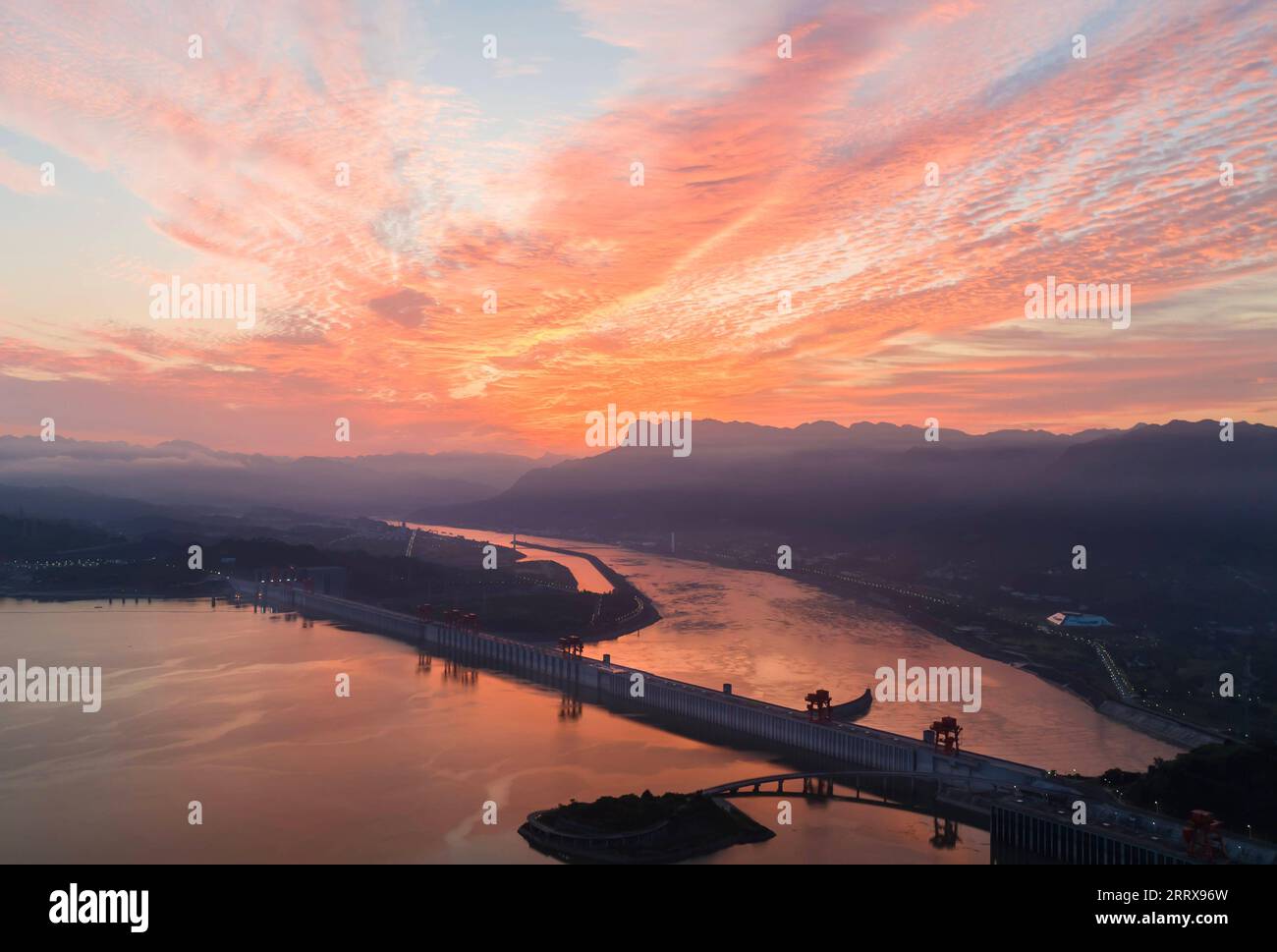 230830 -- ZIGUI, Aug. 30, 2023 -- This aerial photo taken on Aug. 29, 2023 shows sunrise over the Three Gorges dam in Zigui County, Yichang City of central China s Hubei Province. Photo by /Xinhua CHINA-HUBEI-ZIGUI COUNTY-SUNRISE CN ZhengxJiayu PUBLICATIONxNOTxINxCHN Stock Photo
