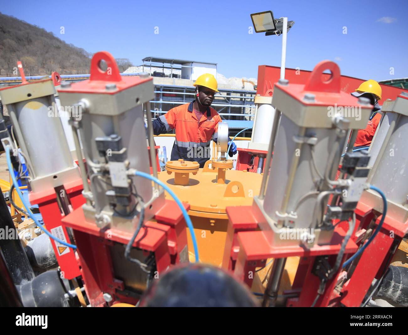 230901 -- BUHERA, Sept. 1, 2023 -- Workers are seen at a floatation plant of Max Mind Zimbabwe s Sabi Star Lithium Mine in Buhera, Zimbabwe, Aug. 31, 2023. Zimbabwean President Emmerson Mnangagwa on Thursday urged lithium miners to increase the added value of the country s lithium resources, stressing the need to produce battery-grade lithium. Mnangagwa made the appeal after the official commissioning ceremony of a floatation plant of Max Mind Zimbabwe s Sabi Star Lithium Mine, which is located in Buhera, about 300 km from the capital city of Harare. Photo by /Xinhua ZIMBABWE-BUHERA-LITHIUM-MI Stock Photo
