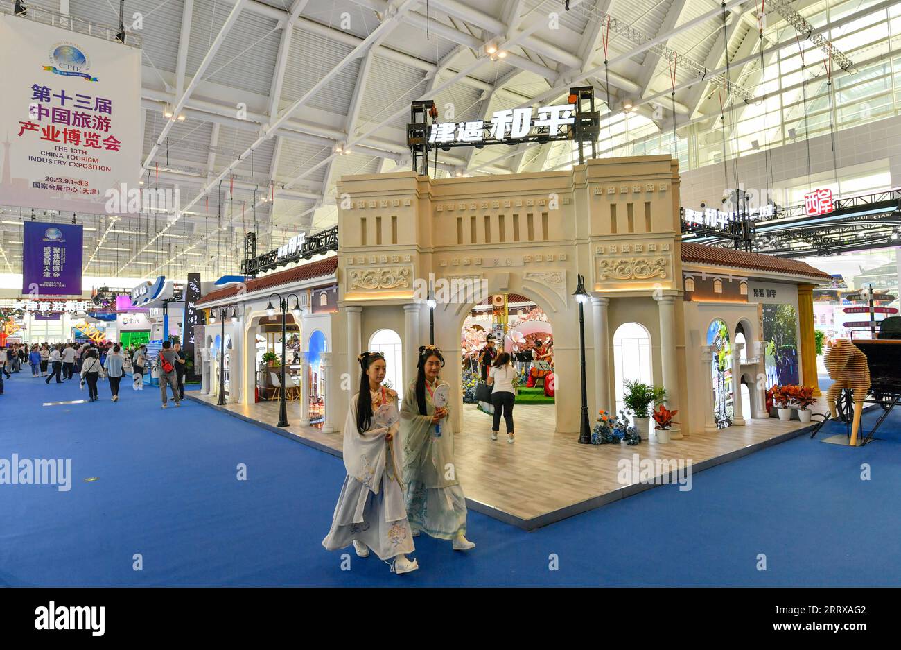 230901 -- TIANJIN, Sept. 1, 2023 -- People visit the 13th China Tourism Industry Exposition in north China s Tianjin Municipality, Sept. 1, 2023. The expo kicked off in Tianjin on Friday, highlighting international cooperation and industrial innovation in the culture and tourism sector. The three-day event, featuring a wide range of activities, including exhibitions, specialized forums and business negotiations, has attracted more than 2,000 cultural and tourism enterprises.  CHINA-TIANJIN-TOURISM INDUSTRY EXPOSITION-OPENING CN SunxFanyue PUBLICATIONxNOTxINxCHN Stock Photo