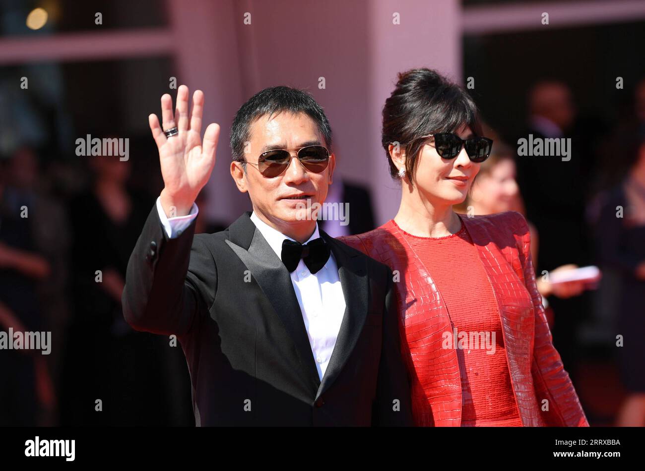 230902 -- VENICE, Sept. 2, 2023 -- Actor Tony Leung Chiu-Wai L and actress Carina Lau pose during the 80th Venice International Film Festival in Venice, Italy, on Sept. 2, 2023. Tony Leung Chiu-Wai of Hong Kong, China was presented with the Golden Lion for Lifetime Achievement during the event on Saturday.  ITALY-VENICE-FILM FESTIVAL-TONY LEUNG CHIU-WAI-GOLDEN LION-LIFETIME ACHIEVEMENT JinxMamengni PUBLICATIONxNOTxINxCHN Stock Photo