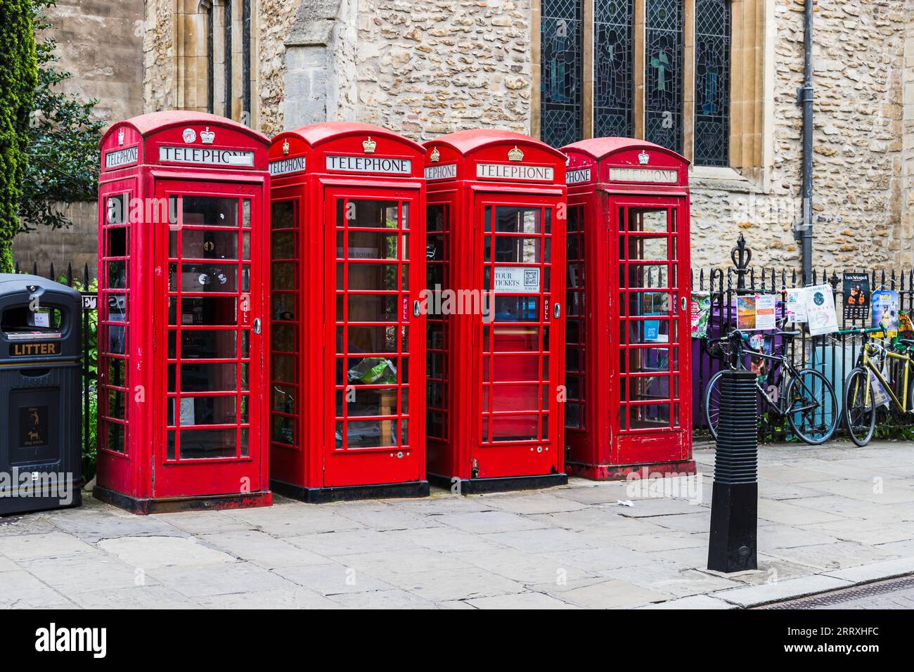 Four telephone boxes in a row seen on the streets of Cambridge, taken 15th Aug 2023. Stock Photo