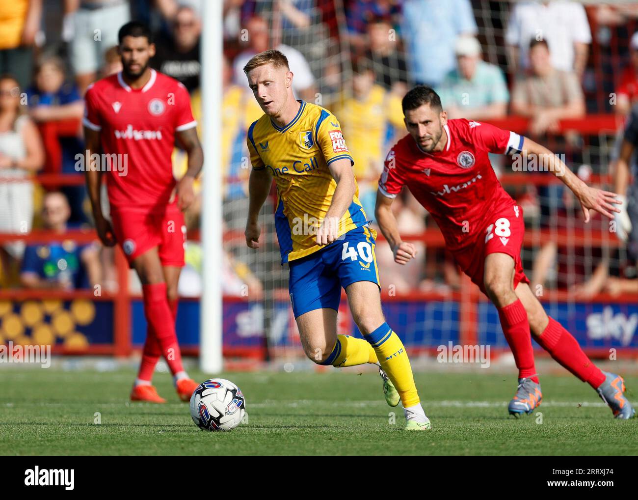 Mansfield Town's Davis KeillorDunn (centre) and Accrington Stanley's