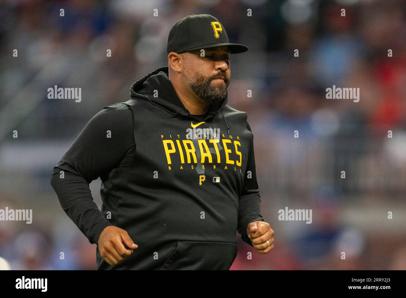 Pittsburgh Pirates pitching coach Oscar Marin jogs back to dugout after