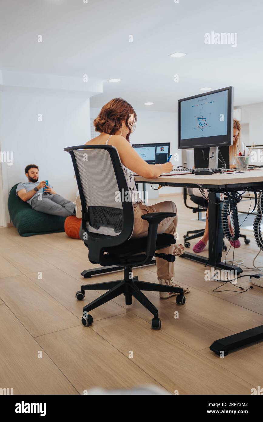 Efficient Team Analyzing Reports in Creative Business Office. Stock Photo